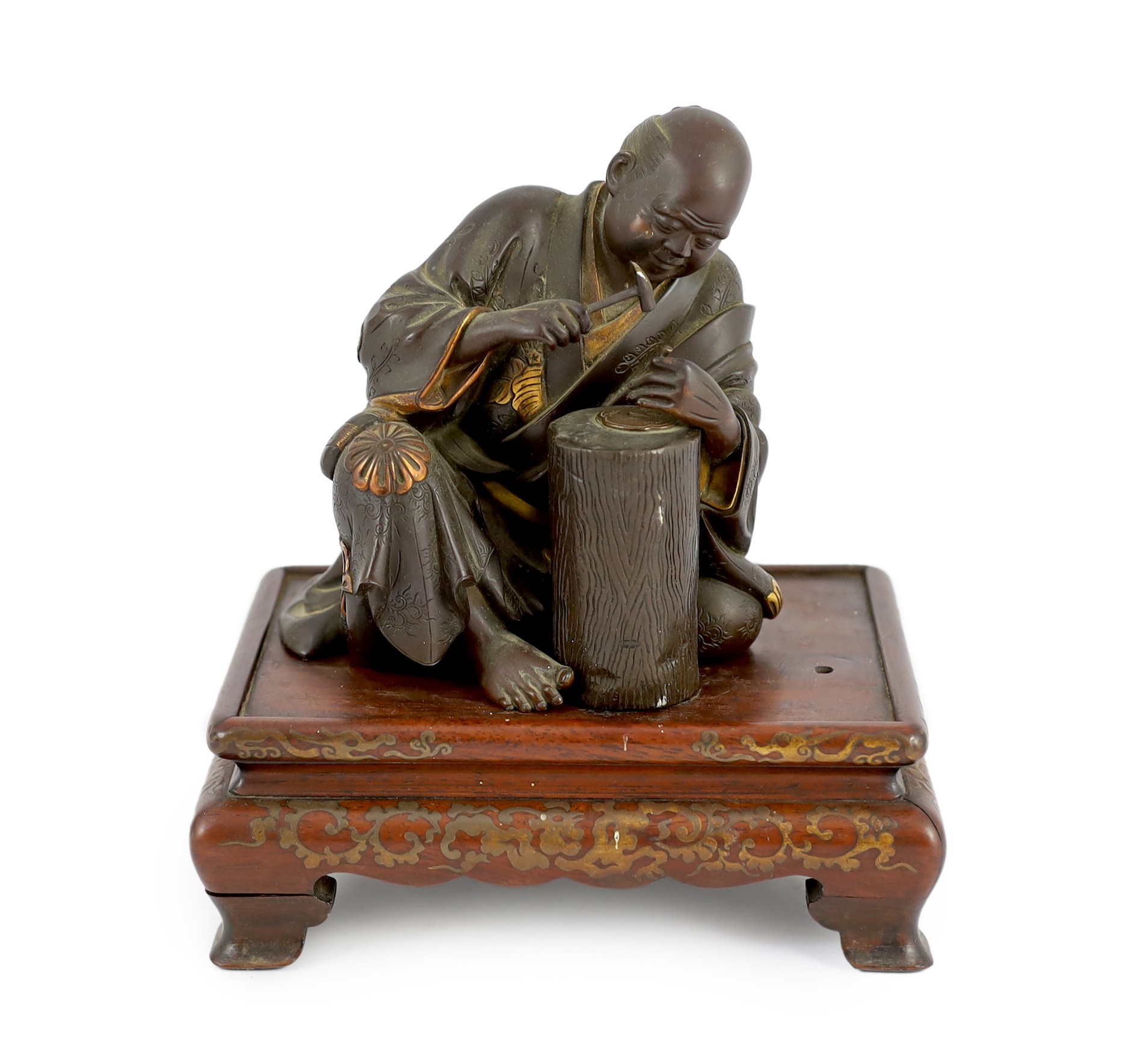 A Japanese bronze model of a sword fittings master craftsman, by Miyao Eisuke, Meiji period, total height 18cm including original gilt lacquered wood stand, small section of bronze lacking                                