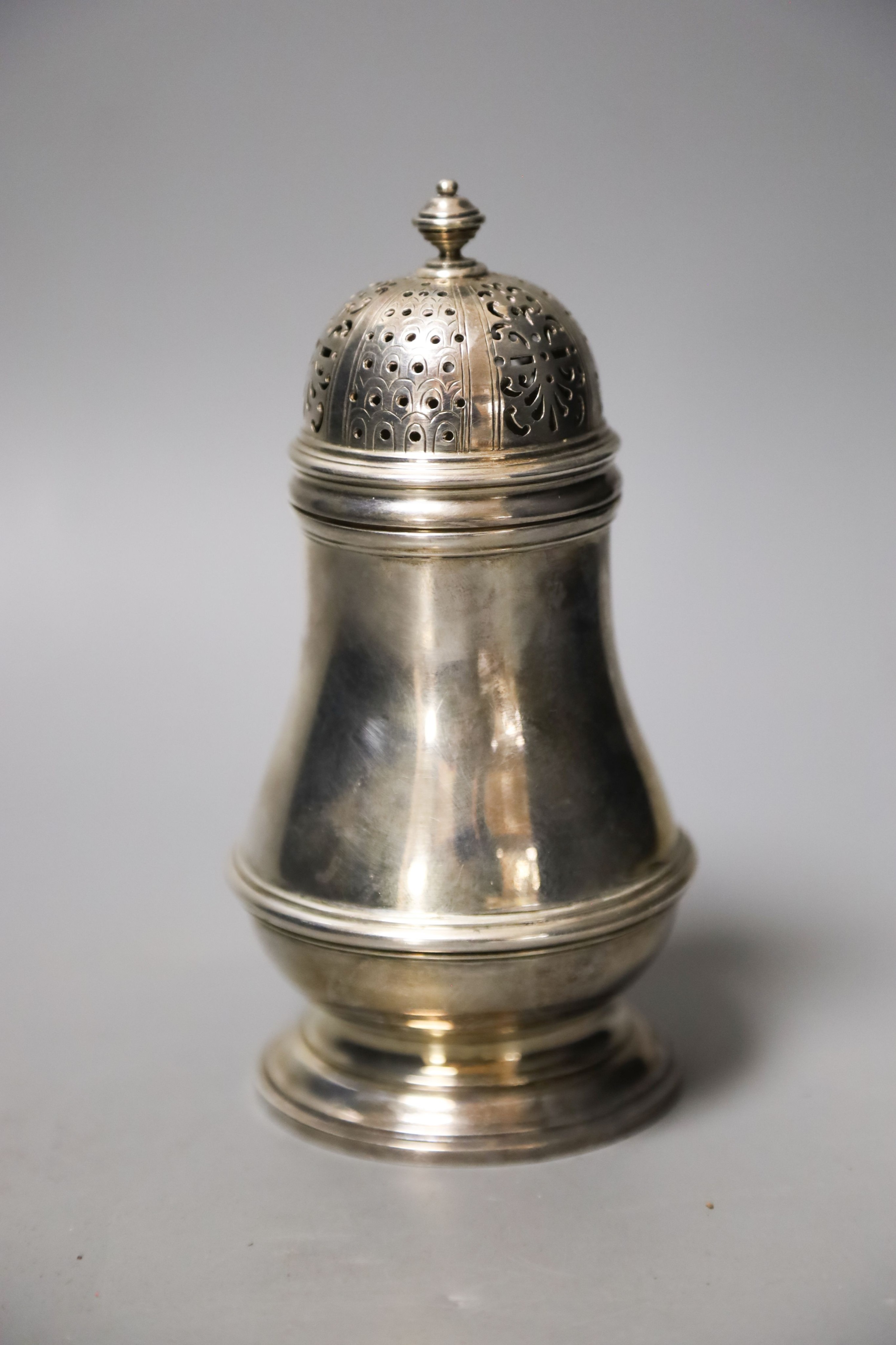 A George VI silver baluster sugar caster, London, 1937, 15.4cm, 8oz.                                                                                                                                                        