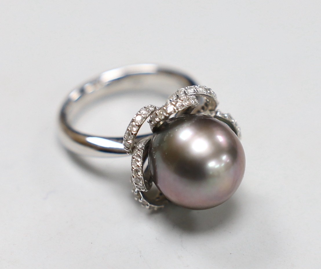 A modern Italian 750 white metal, cultured pearl and diamond chip set dress ring, with accompanying GCS report dated 10/11/2022, size M/N, gross weight 11.2 grams.                                                         