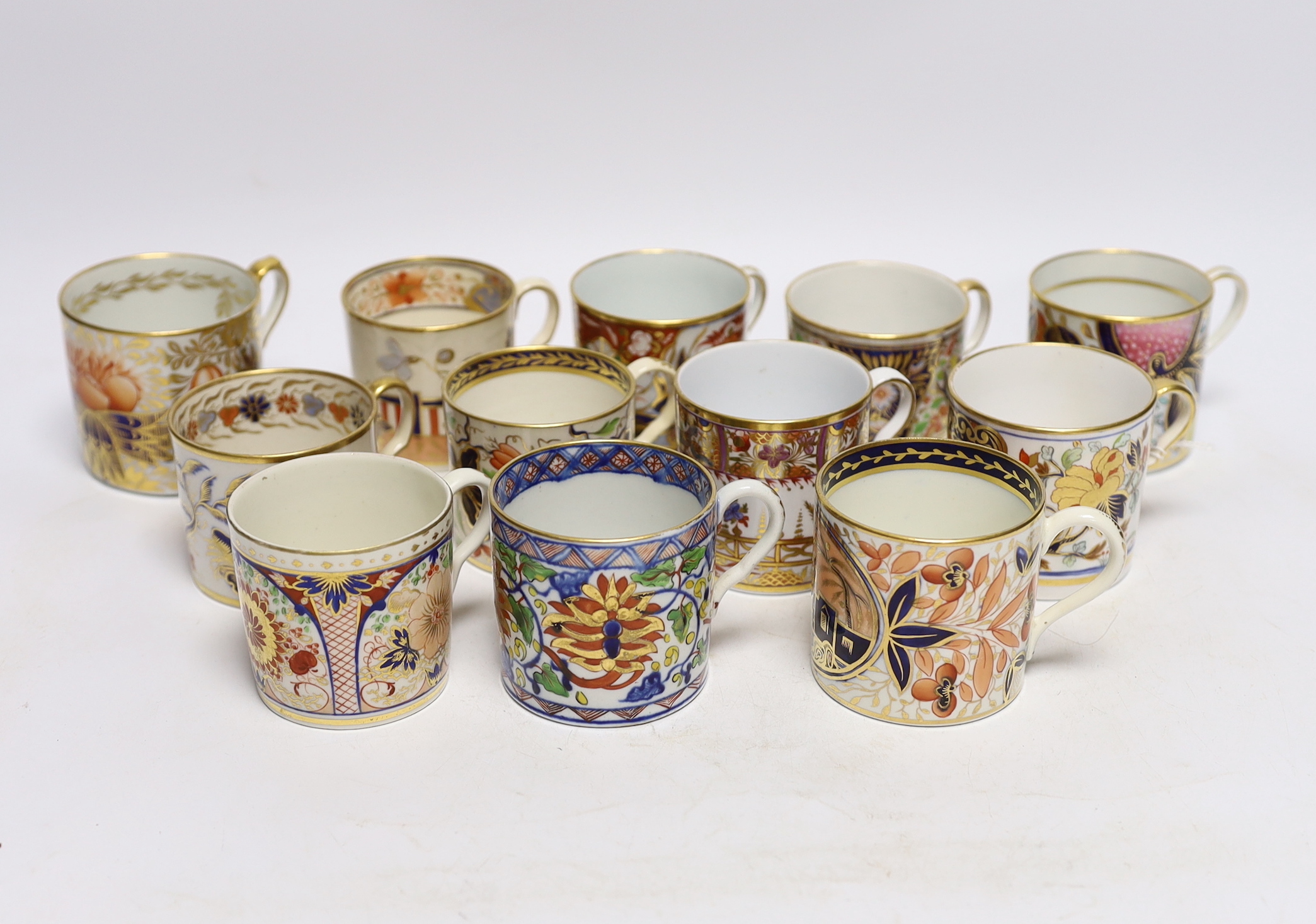 Twelve 1800-1820 English porcelain coffee cans, including Imari pattern examples                                                                                                                                            