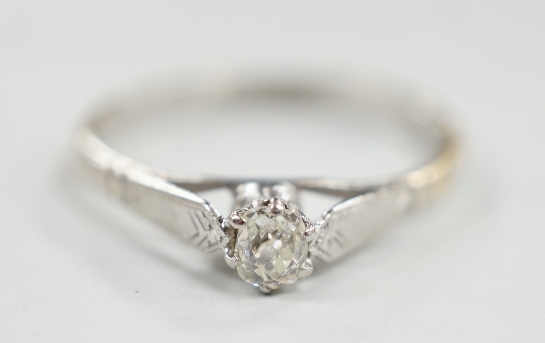 An 18ct, plat and solitaire diamond set ring, size P/Q, gross weight 2.1 grams.                                                                                                                                             
