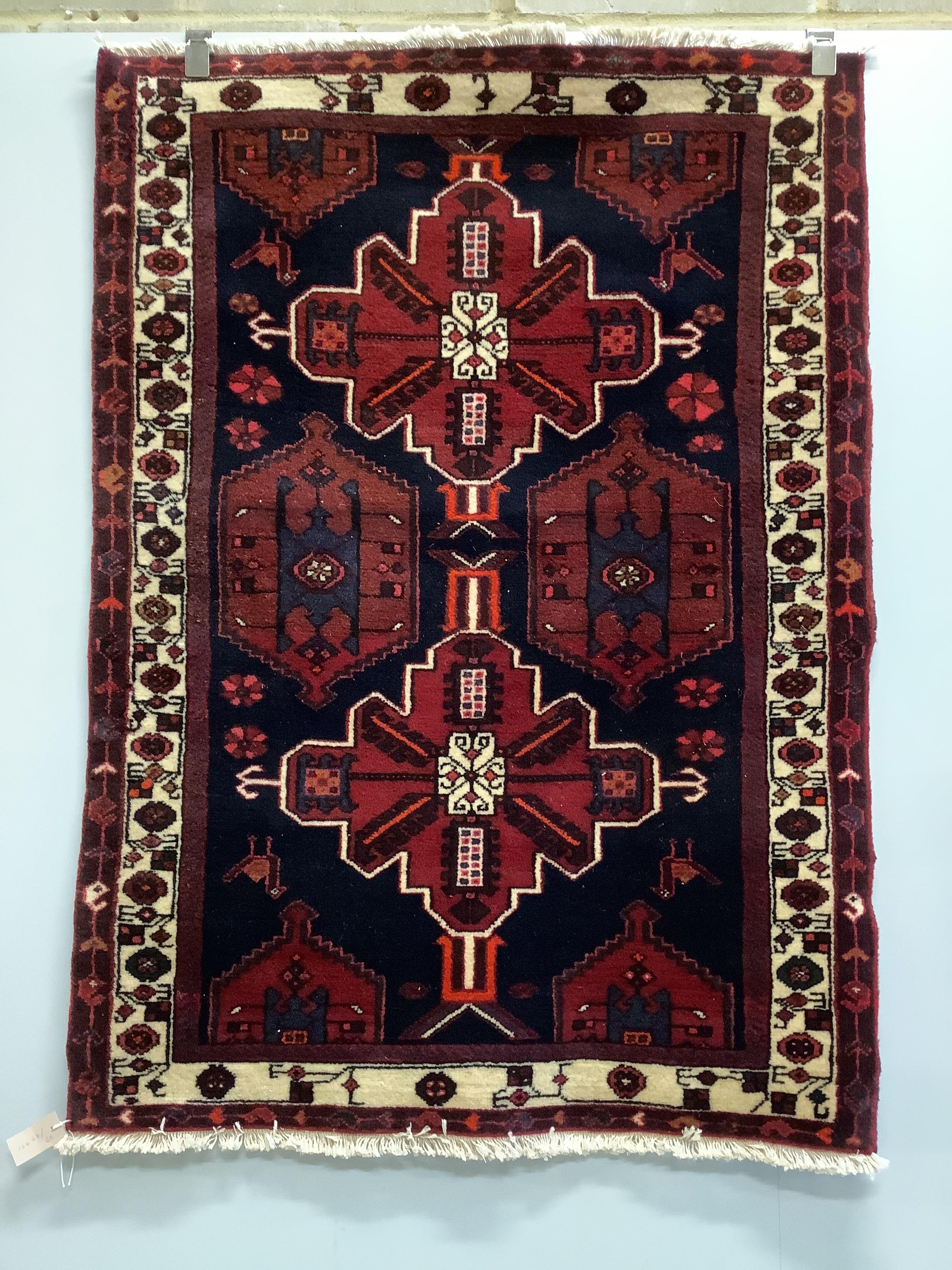 A Turkish blue ground rug, 144 x 102cm                                                                                                                                                                                      