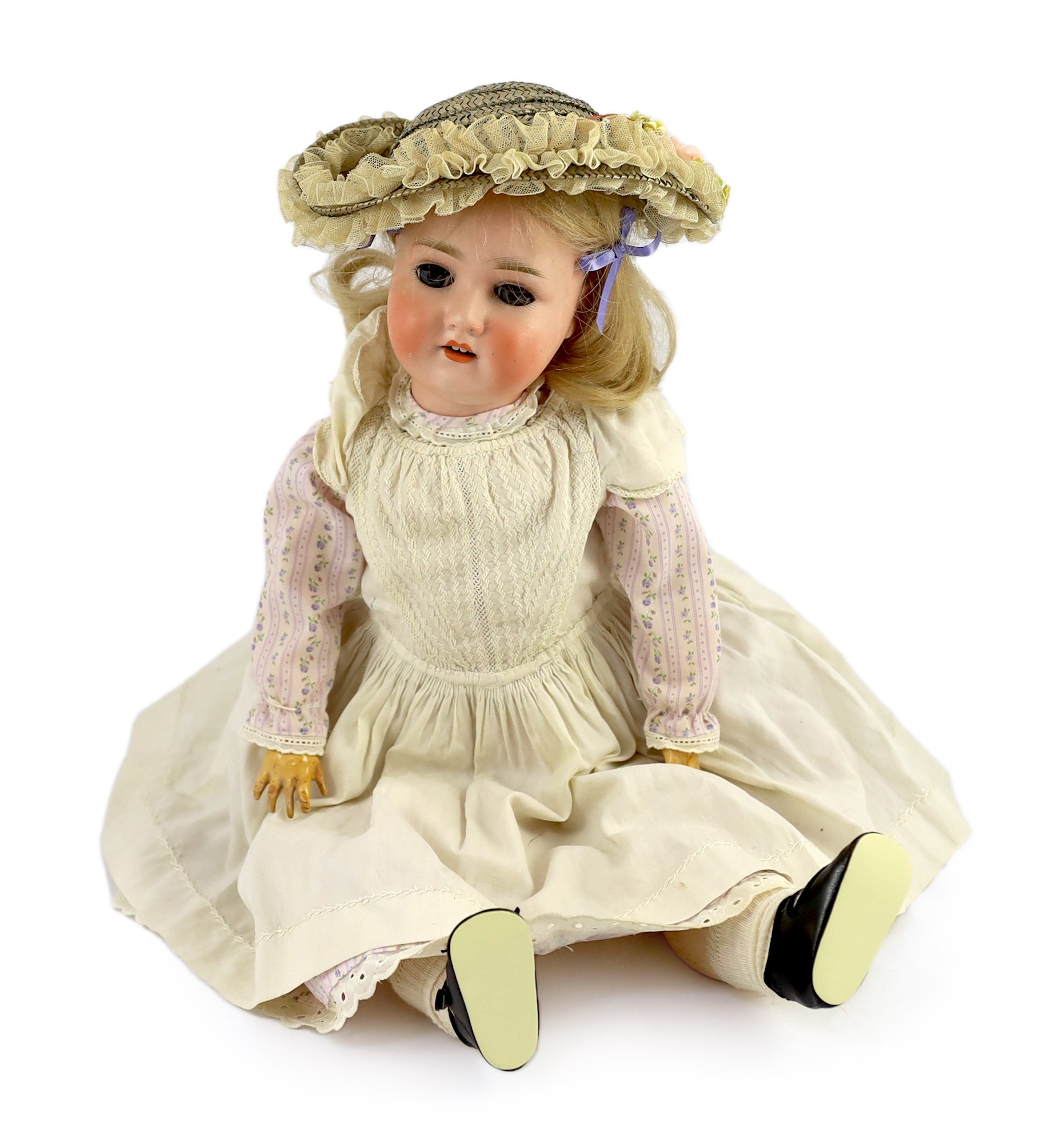 A Schoenau & Hoffmeister bisque doll, German, circa 1909, 21in.                                                                                                                                                             