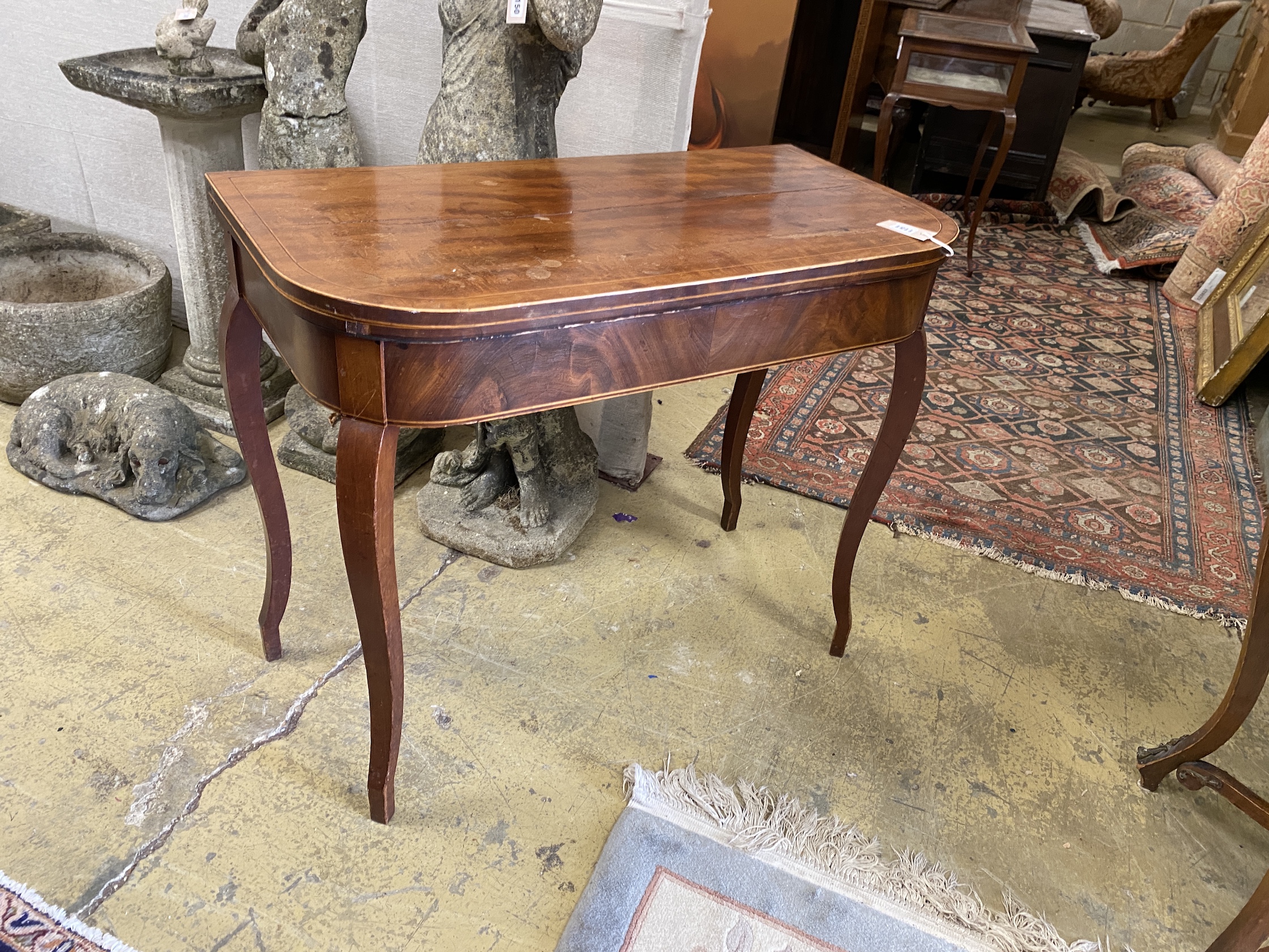 A George III mahogany D shaped folding card table, width 89cm, depth 45cm, height 75cm                                                                                                                                      