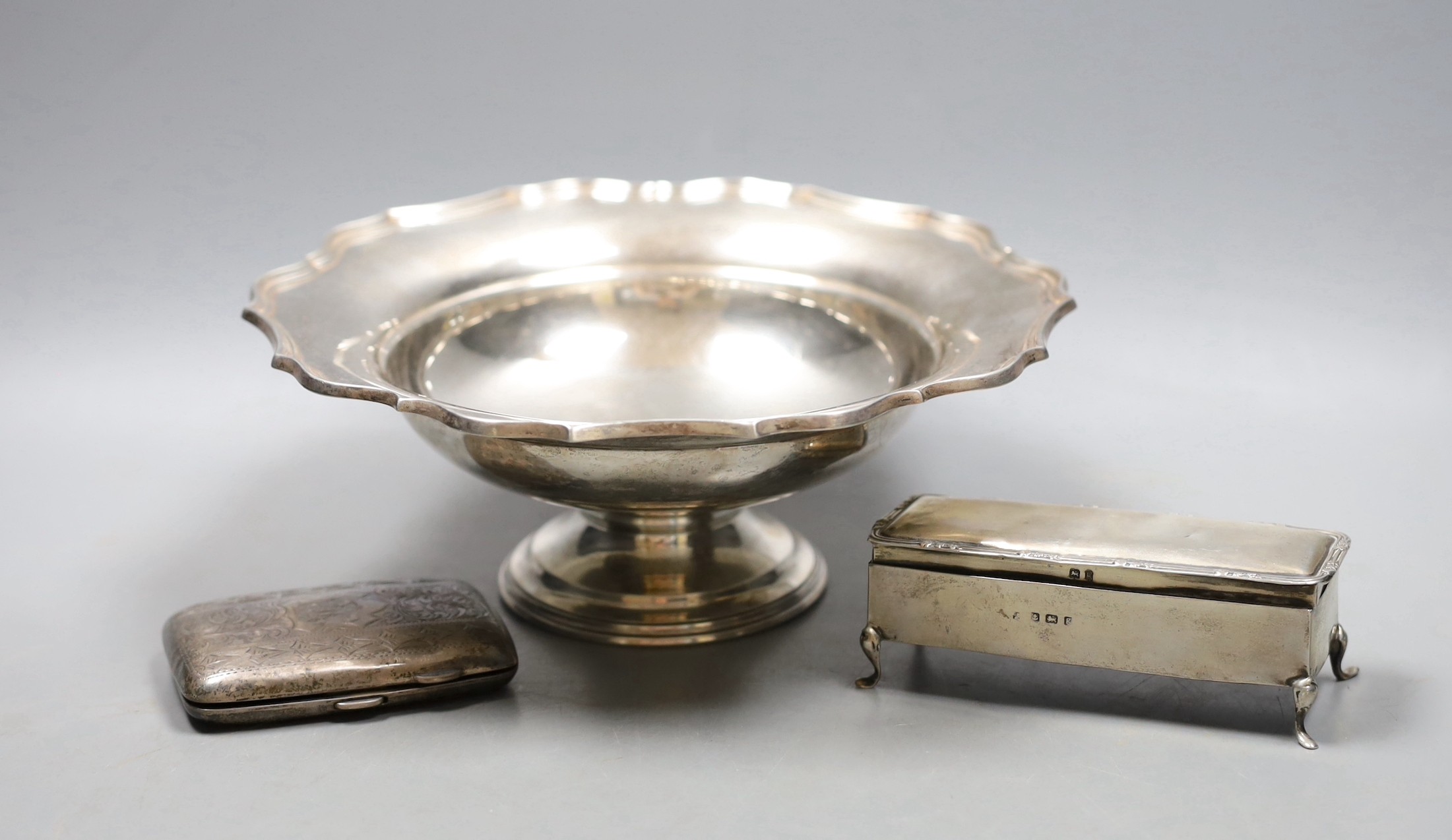 A George V silver pedestal dish, with presentation inscription, Barker Brothers , Chester, 1918, diameter 21.2cm, 9oz, a silver cigarette case and a silver mounted rectangular trinket box                                 