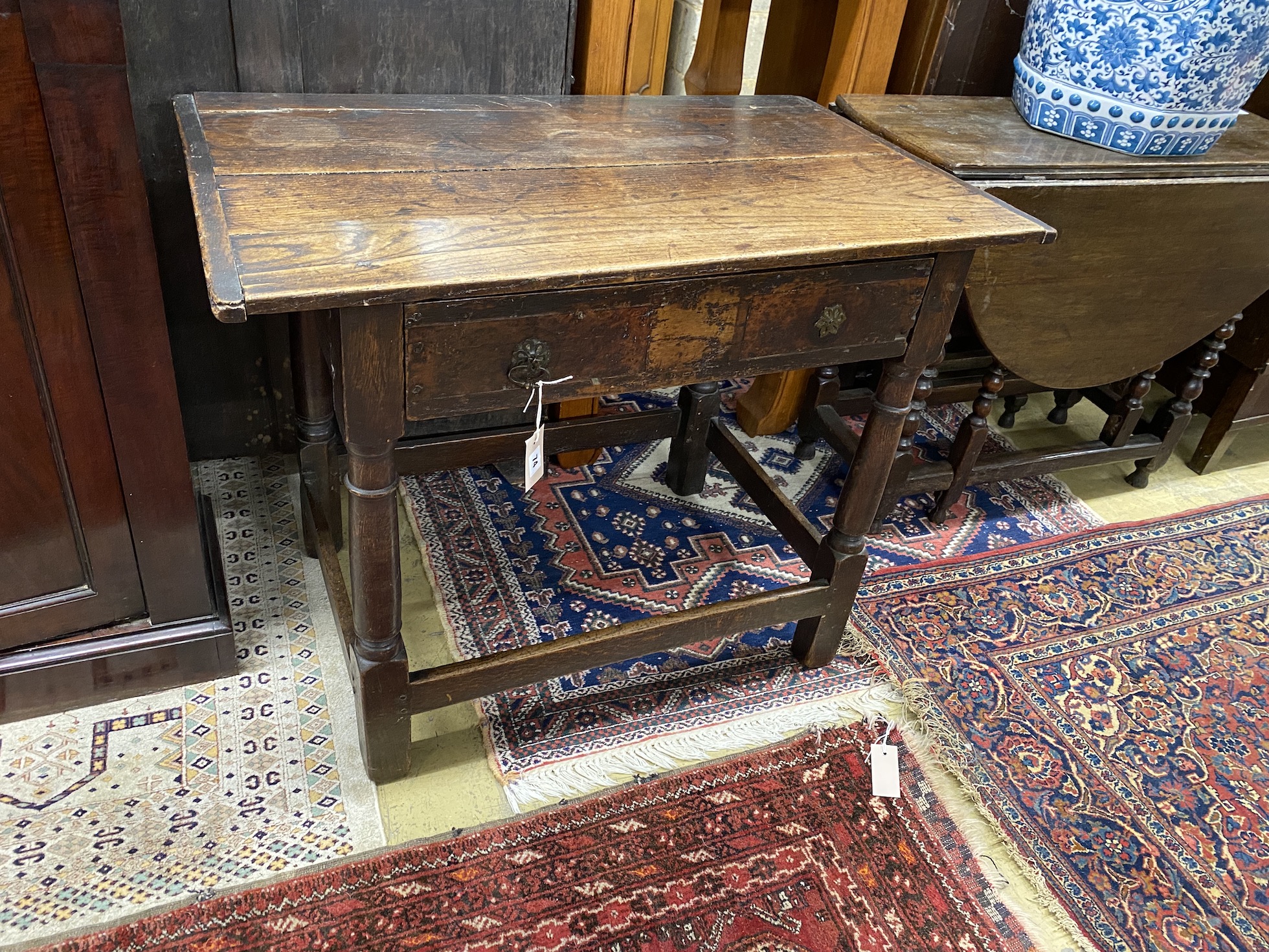 An 18th century oak two drawer side table, width 91cm, depth 56cm, height 70cm                                                                                                                                              