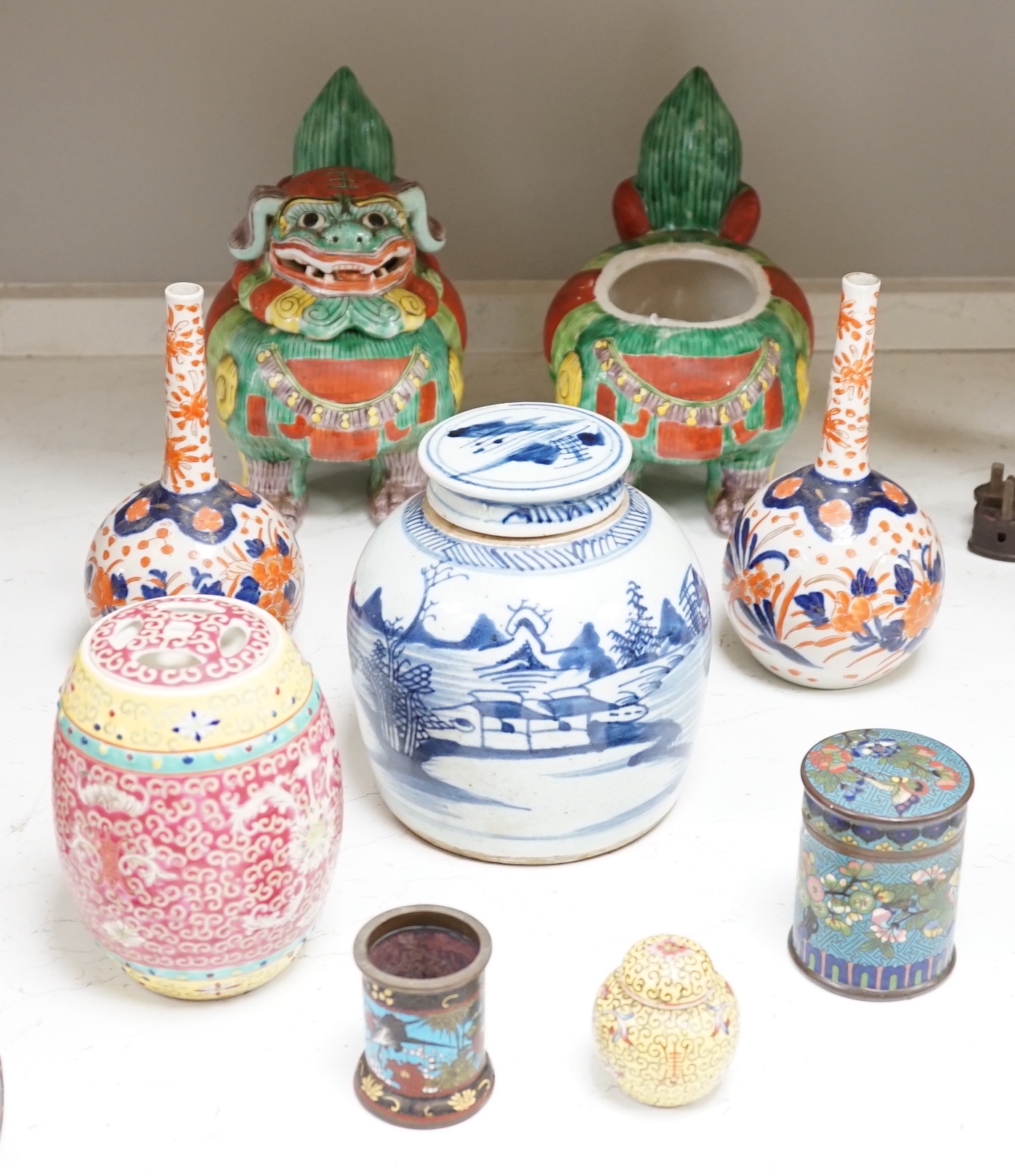 A collection of 20th century Chinese and Japanese ceramics including pair of Imari bottle neck vases, blue and white jar and cover and a pair of dog of foo pots and covers (one cover missing) together with two cloisonné 