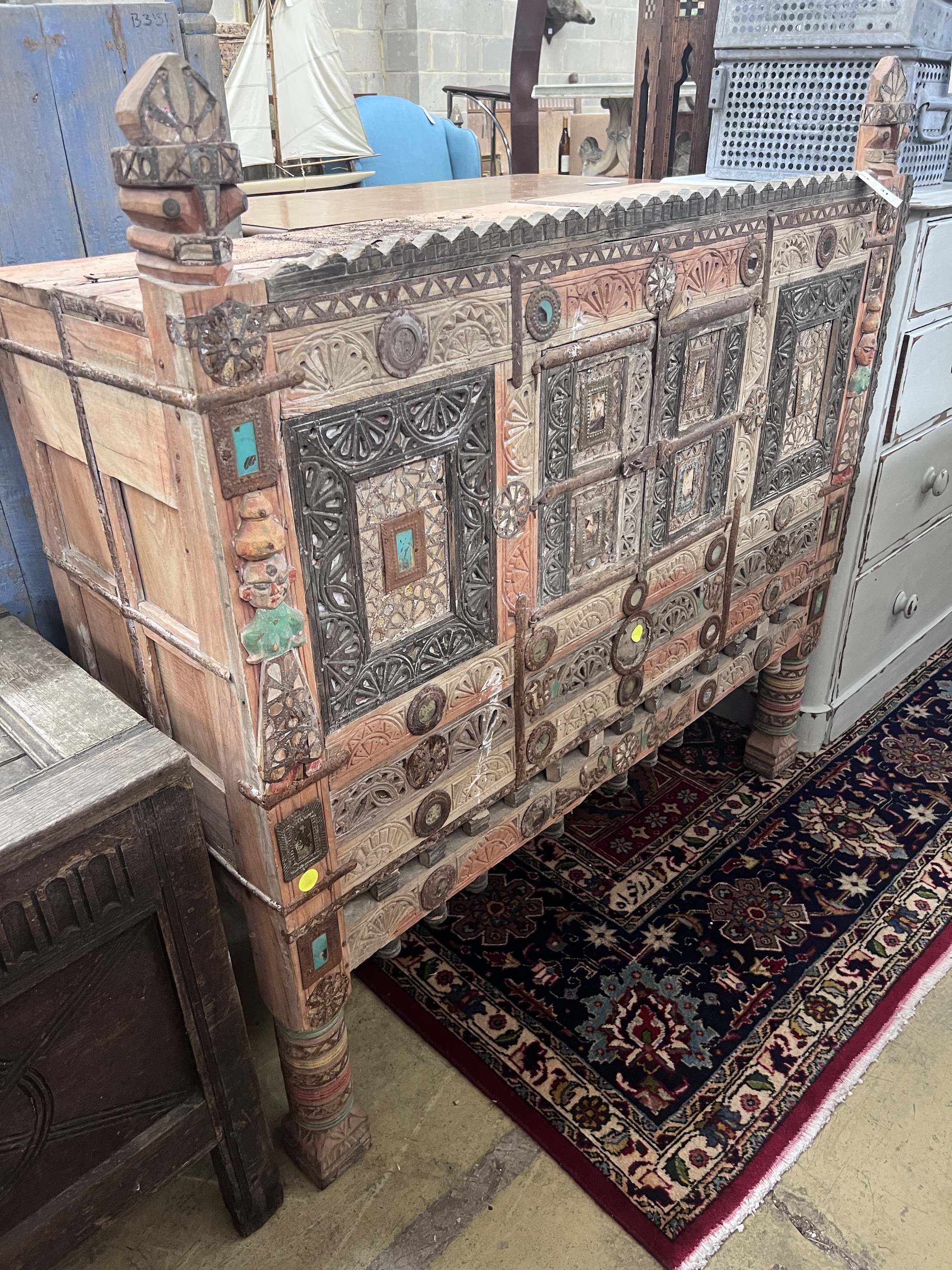 An Indian painted carved hardwood cabinet, width 124cm, depth 43cm, height 125cm                                                                                                                                            