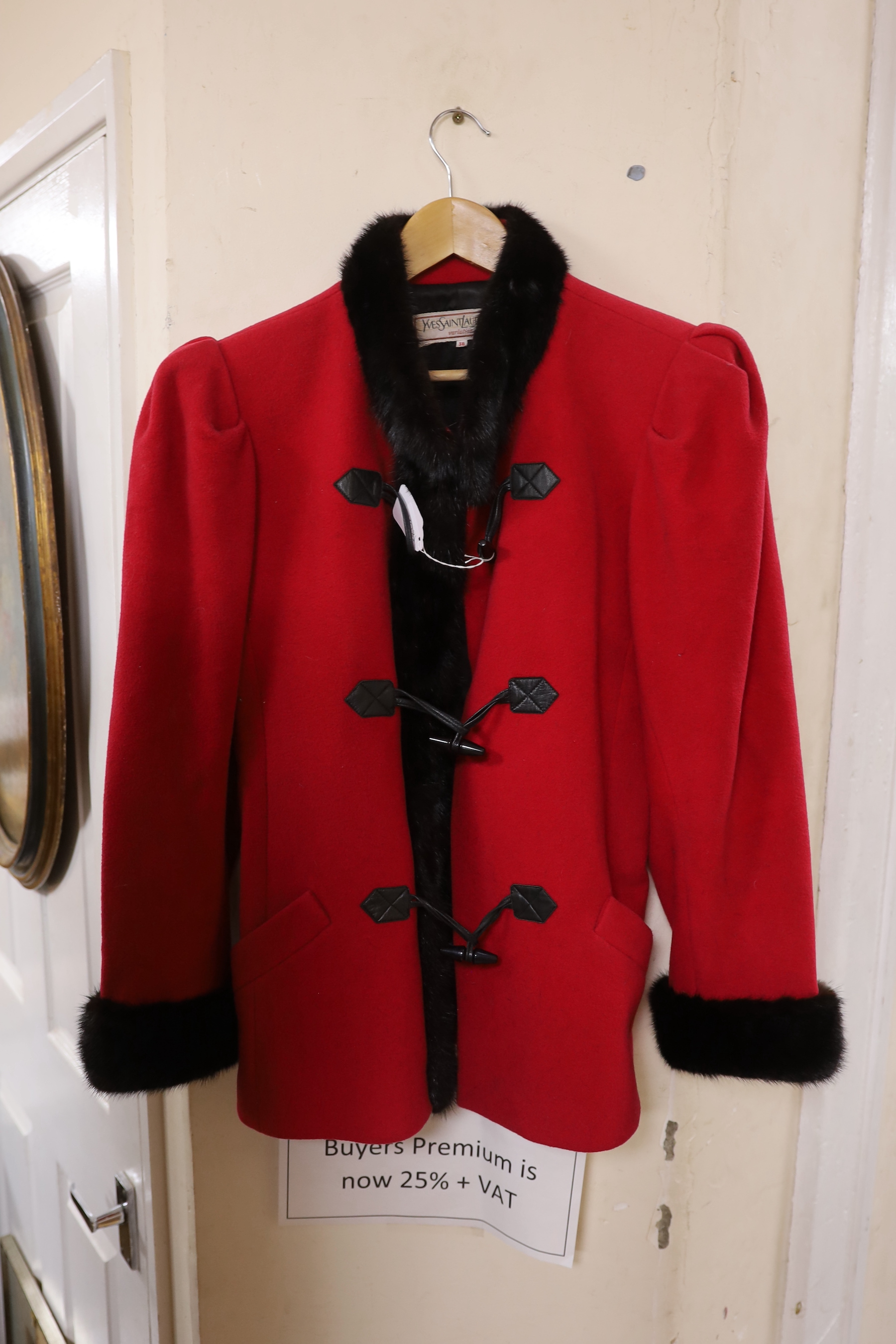 An Yves Saint Laurent ‘variation’, 1980's red wool jacket trimmed with black mink and leather toggle fastening detail (size 36)                                                                                             