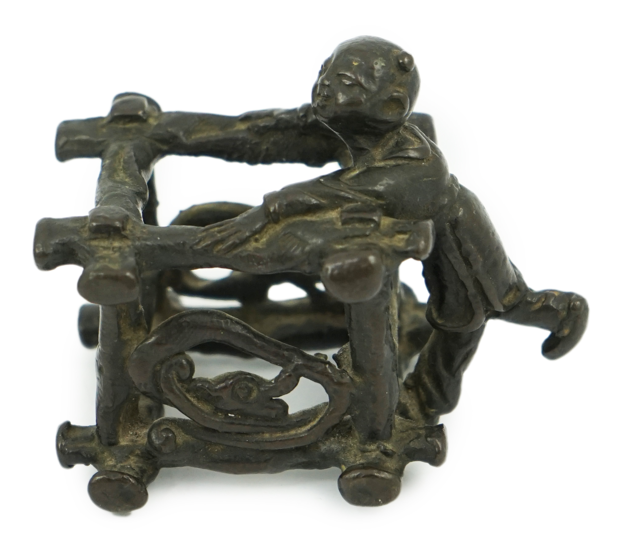 A Chinese bronze figural scroll weight, late Ming                                                                                                                                                                           