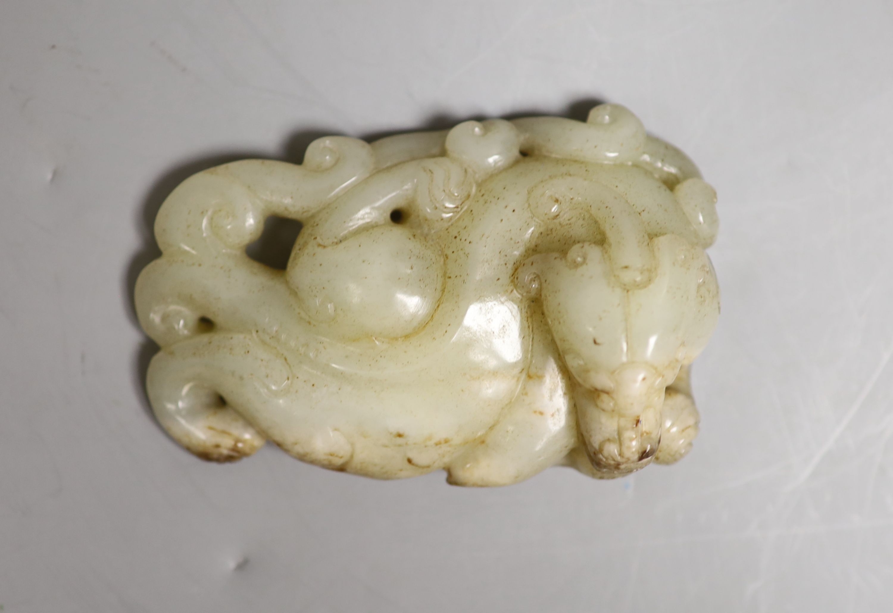 A Chinese pale celadon jade figure of a pixin, 11cm wide                                                                                                                                                                    