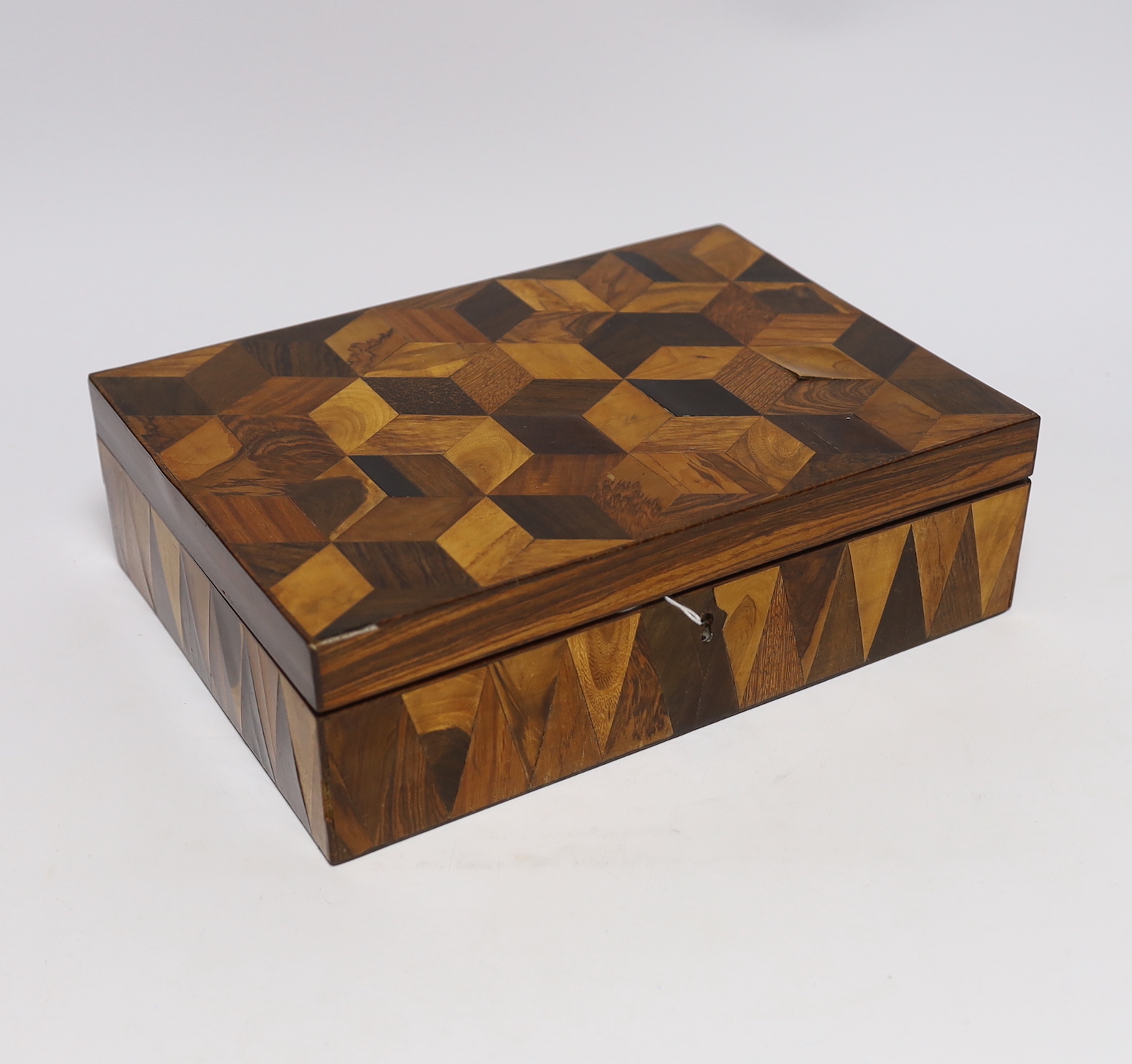 An early 19th century specimen wood perspective cube marquetry jewellery box, 27cm wide, 19.5cm deep, 8cm high                                                                                                              