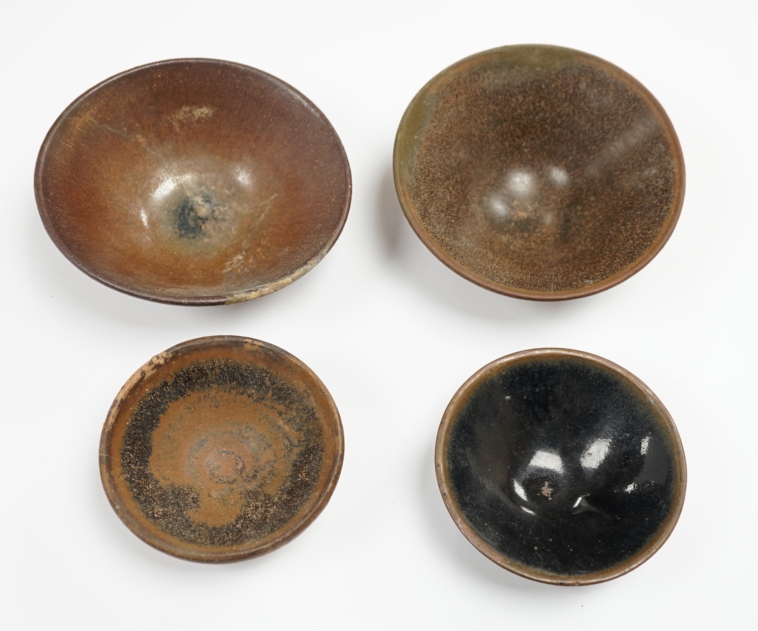 Four Chinese Jian ware bowls, Song dynasty, hare’s fur etc. largest 12cm in diameter                                                                                                                                        