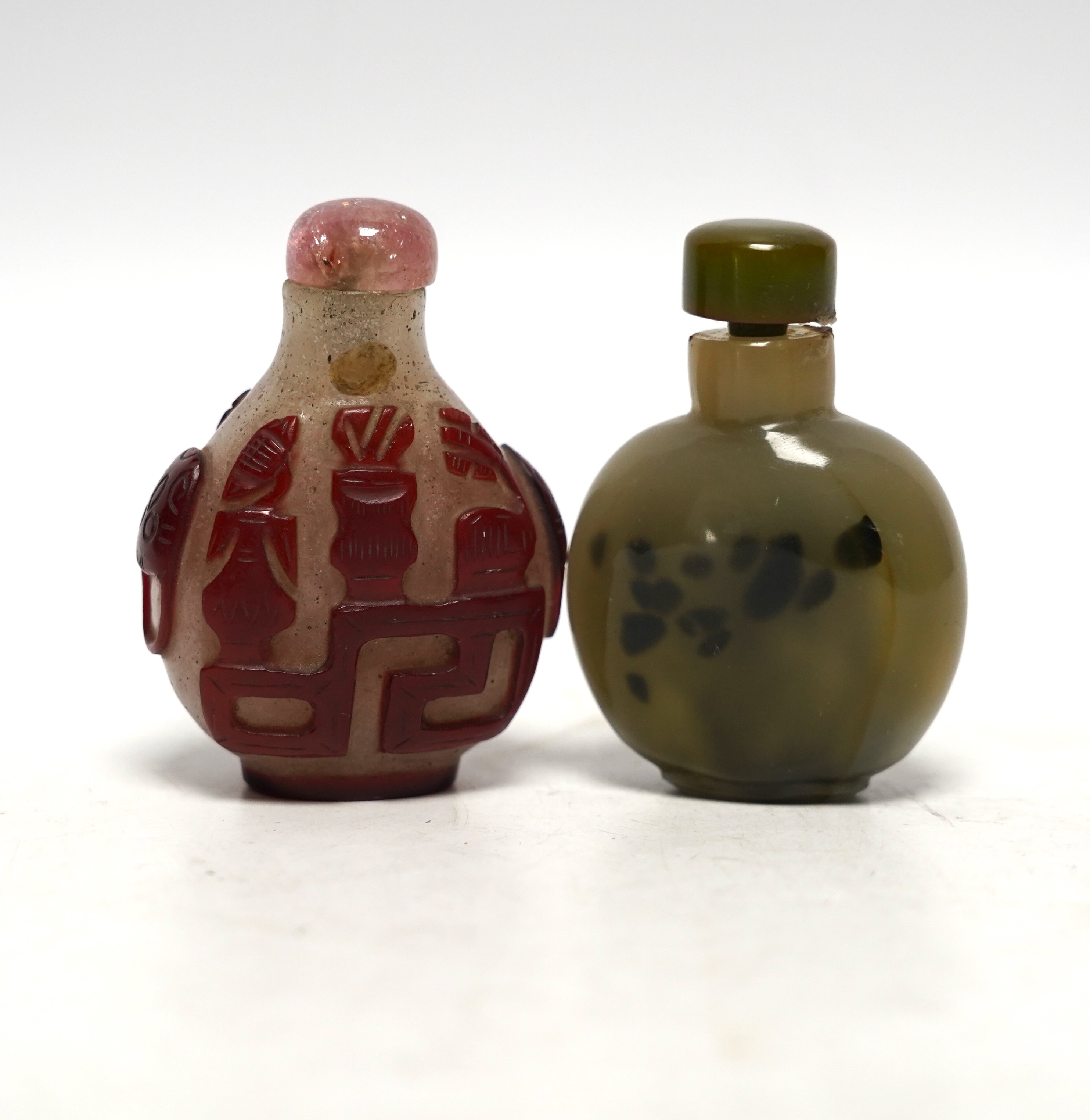 Two Chinese glass snuff bottles, 19th century, largest 7cm high                                                                                                                                                             