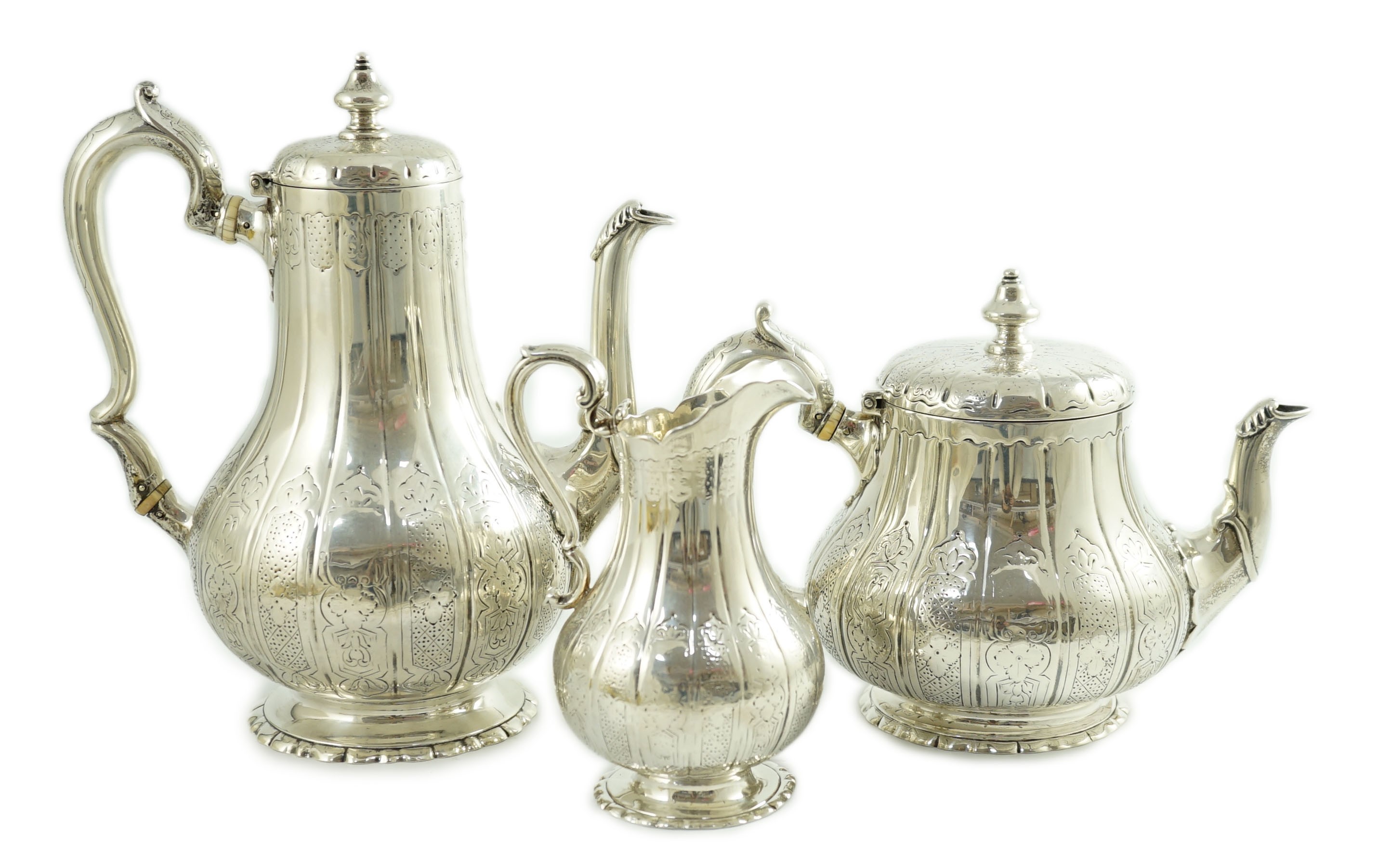A Victorian silver three piece coffee set, comprising pot, cream and sugar bowl, by Walter Morrisse                                                                                                                         
