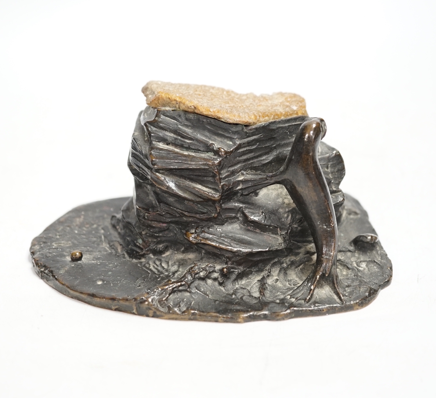 A bronze desk weight, a seal on rock, quartz mounted, 15cm wide                                                                                                                                                             