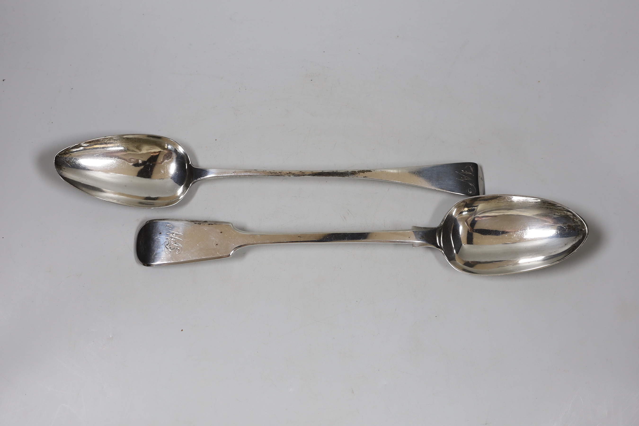 A George III Old English pattern basting spoon, London, 1811, 29.4cm and a later silver fiddle pattern basting spoon, London, 1859, 7.8oz.                                                                                  