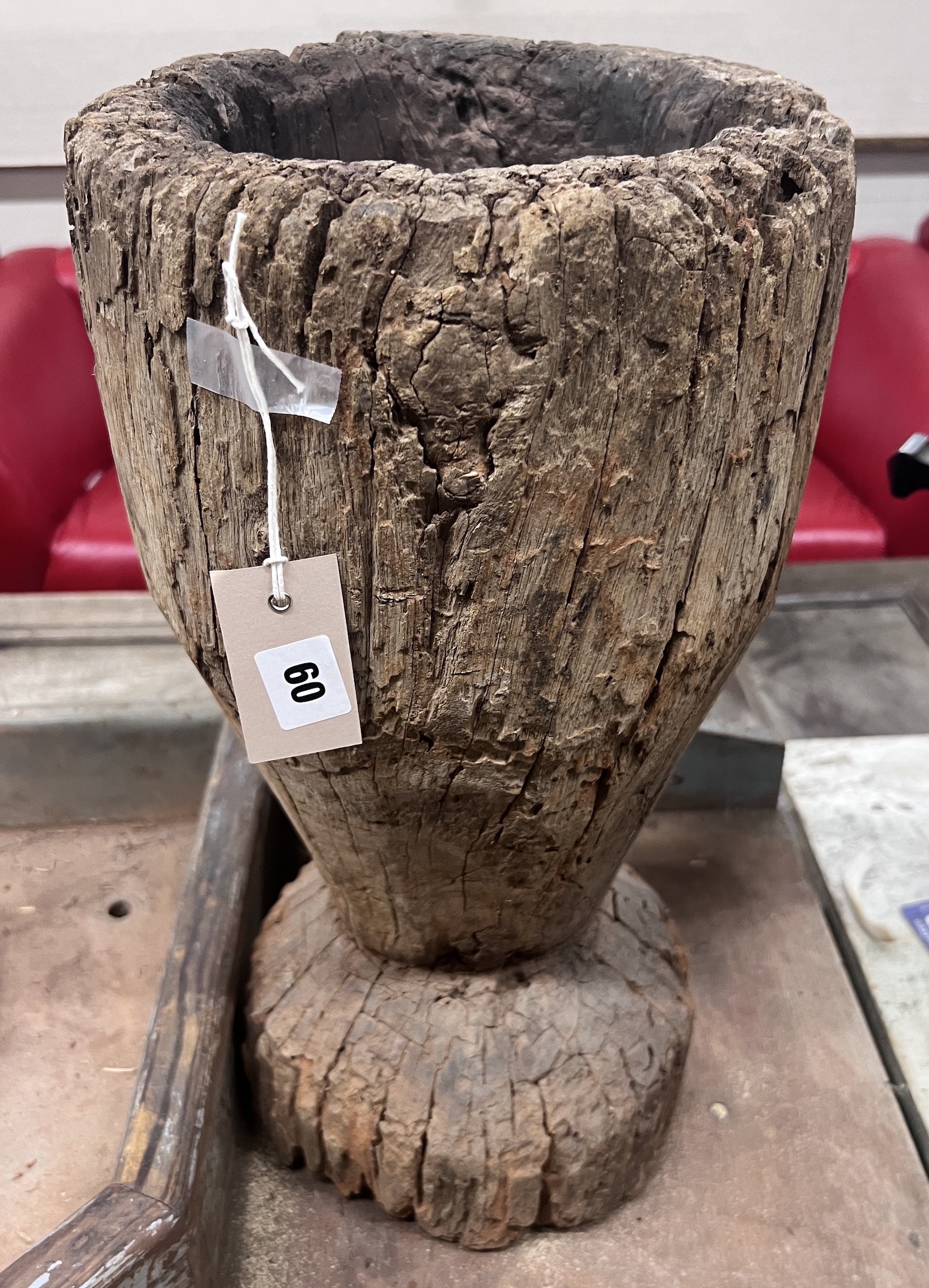 A carved hardwood mortar, height 49cm                                                                                                                                                                                       