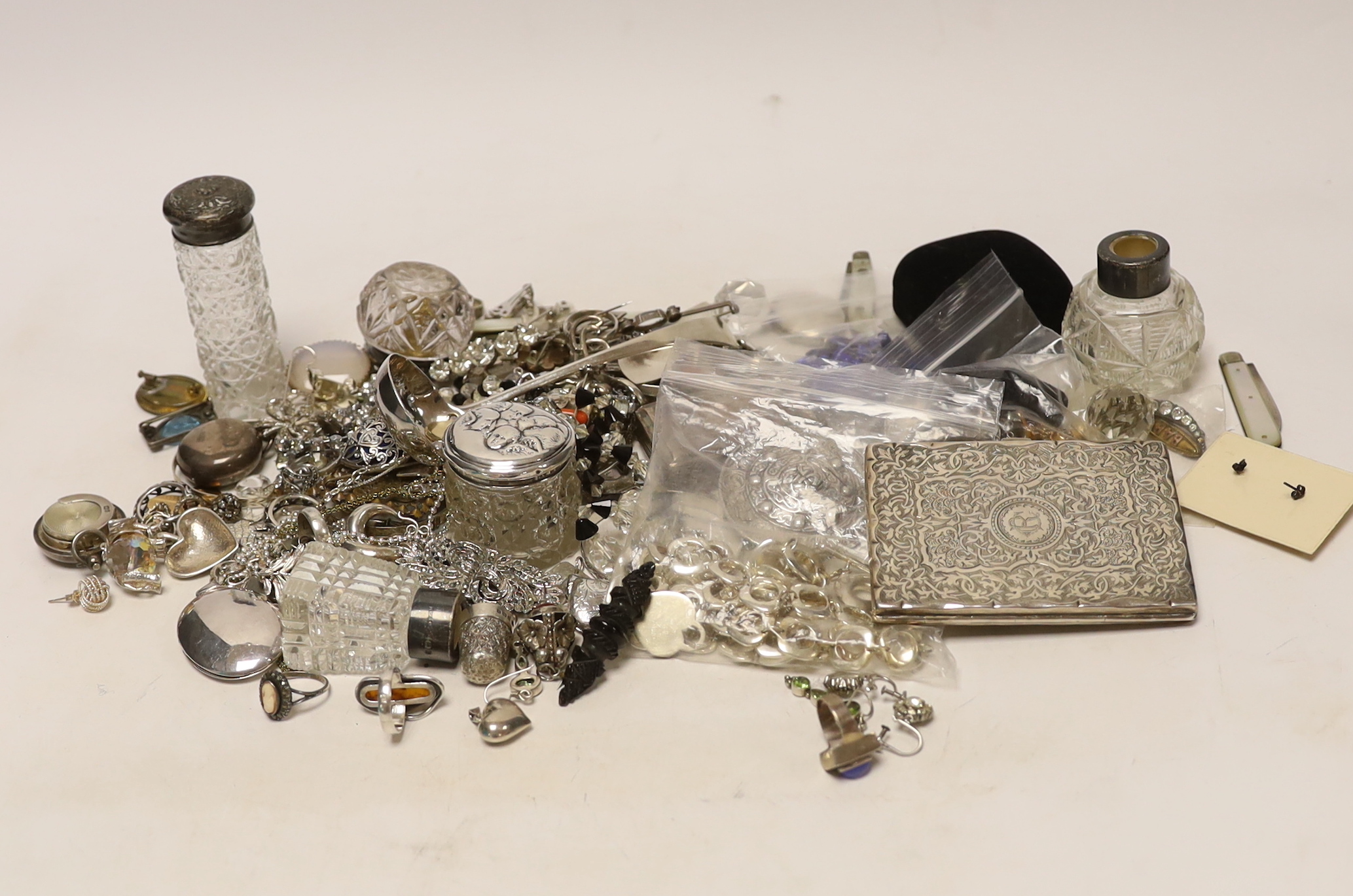 A group of assorted silver and jewellery, including a 19th century snuff box, sifter spoon and card case, a later toilet jar, scent bottle and sovereign case, necklaces, earrings and lockets including white metal and oth