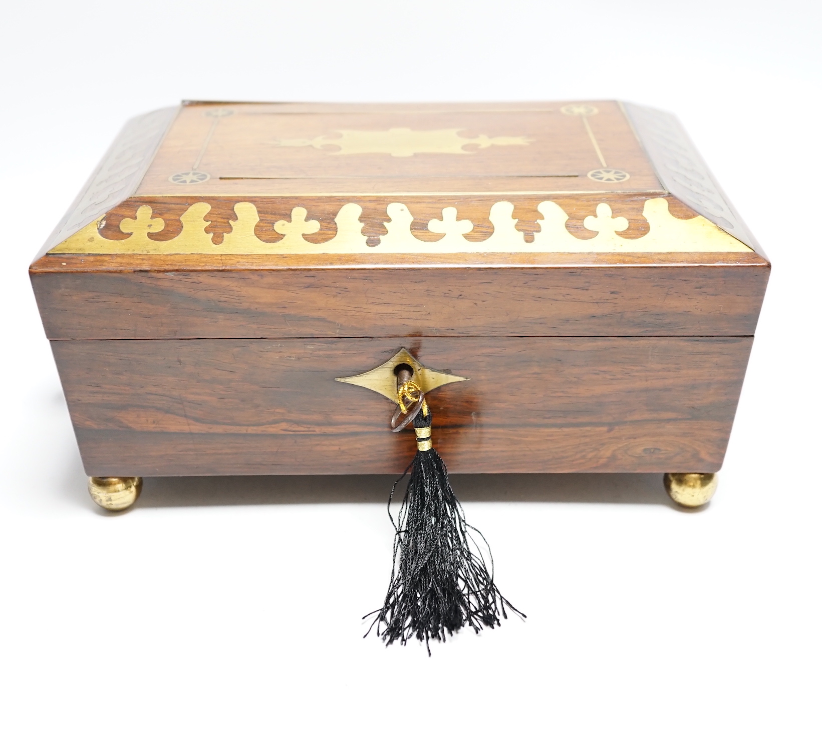 A George IV rosewood and cut brass sewing box with fitted interior, cotton reels, thread and sewing implements, 30cm wide                                                                                                   