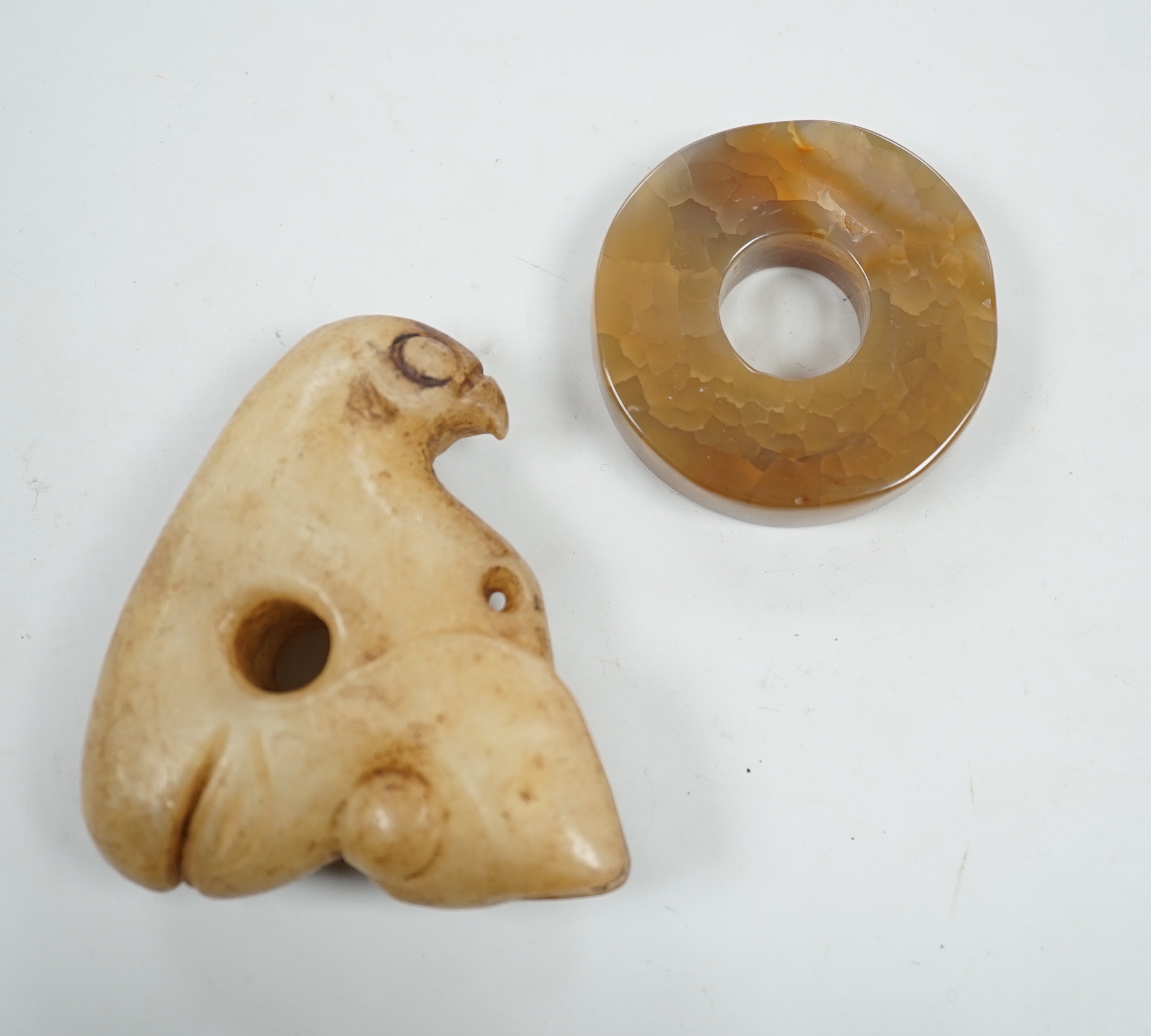 A Chinese agate bi disc and an archaistic jade eagle, 8.5cm                                                                                                                                                                 