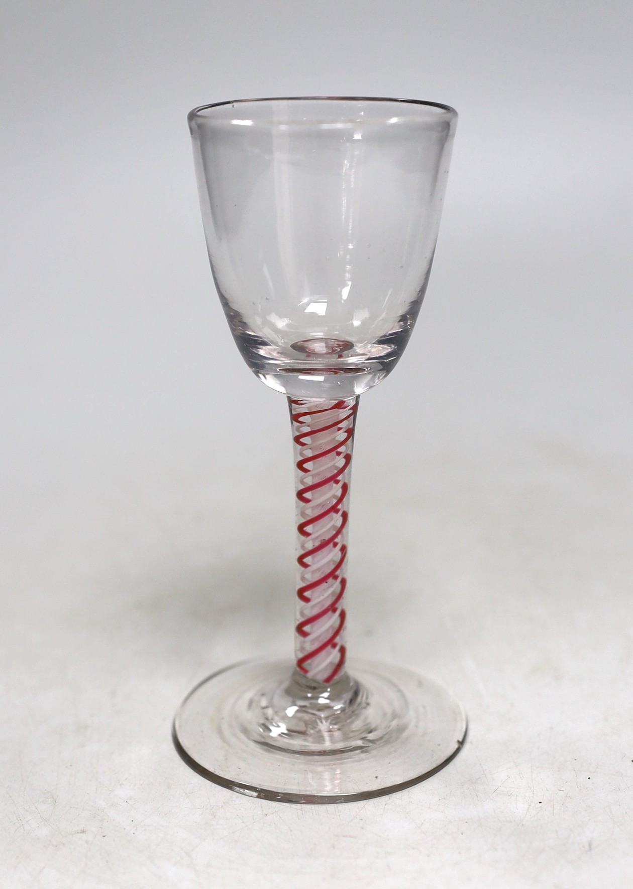 A Dutch red and white colour twist stem wine glass. 15cm tall                                                                                                                                                               