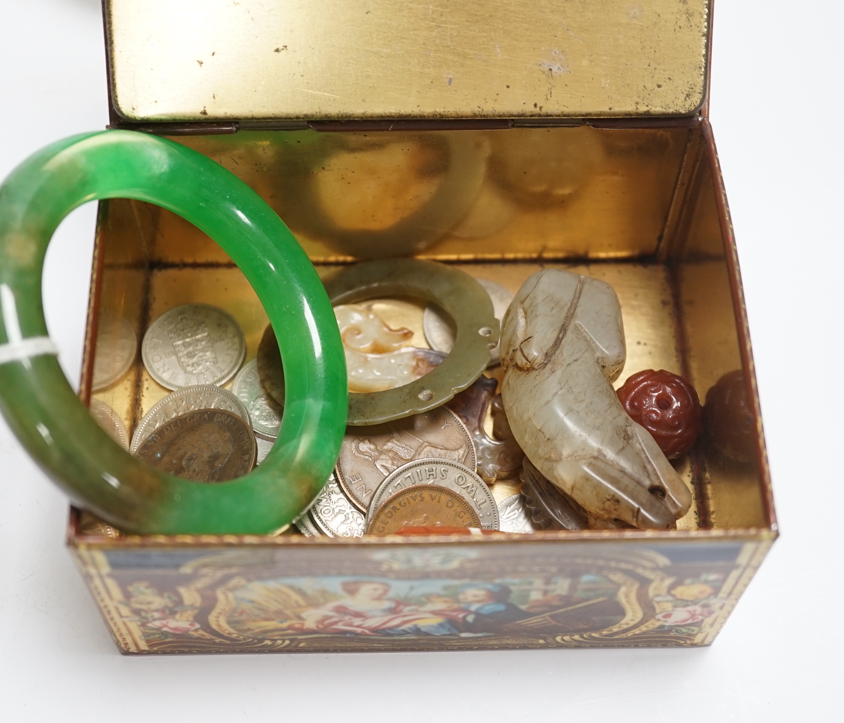 A group of various collectables including jades, coins, etc.                                                                                                                                                                