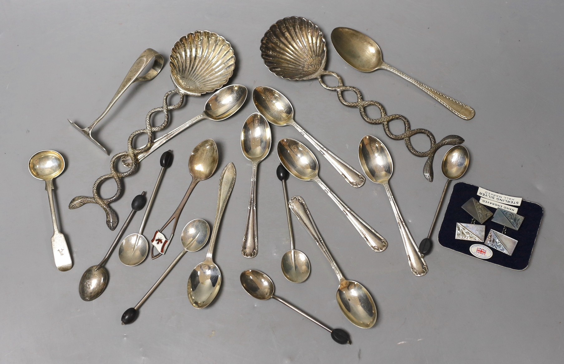 A small group of sundry flatware including a set of six George V silver teaspoons, Sheffield, 1923, a set of six silver bean end coffee spoons etc. and a pair of white metal shell bowl spoons.                            