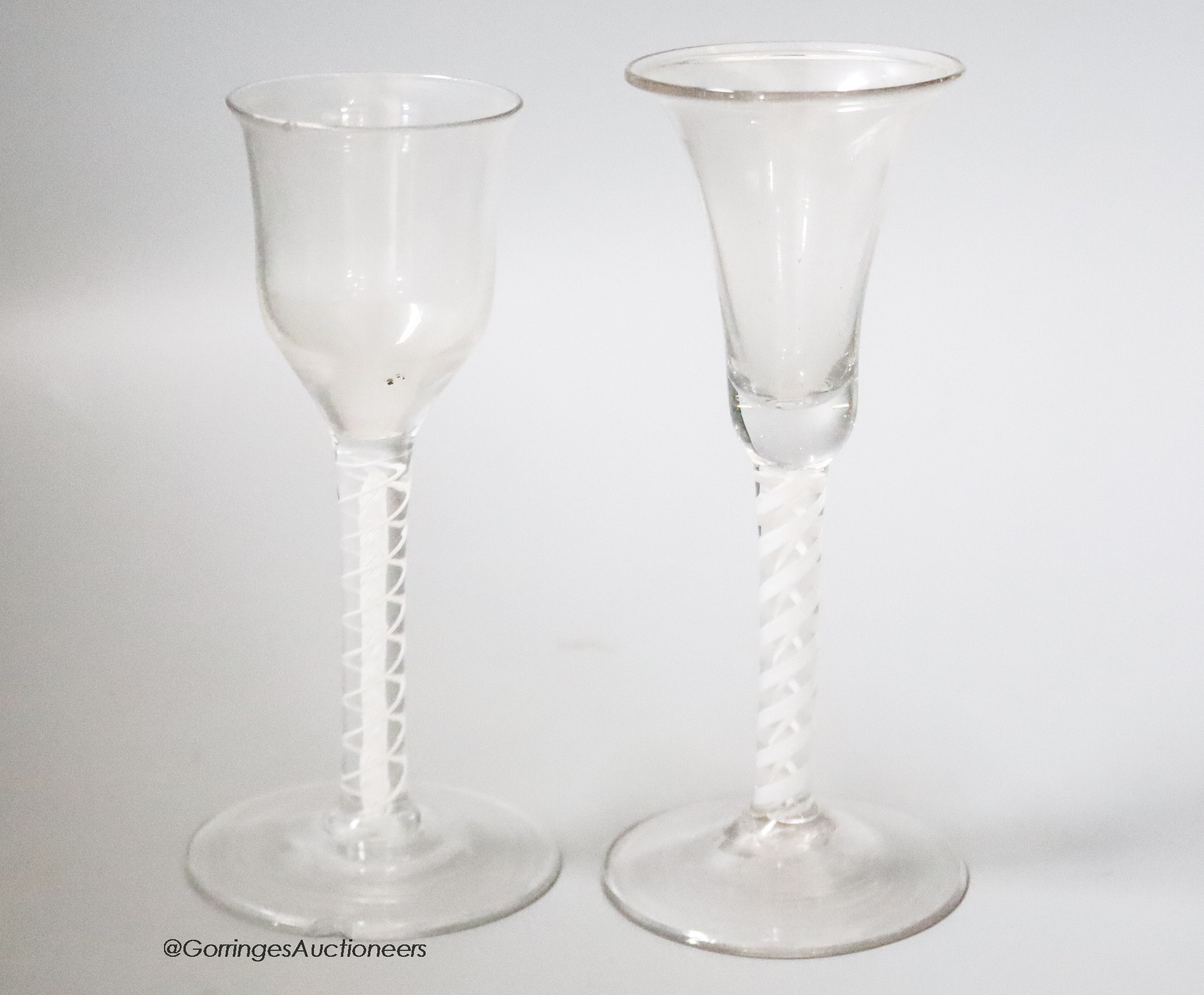 Two 18th century cotton twist stemmed wine glasses, tallest 15.5cm, one wth a rim chip                                                                                                                                      