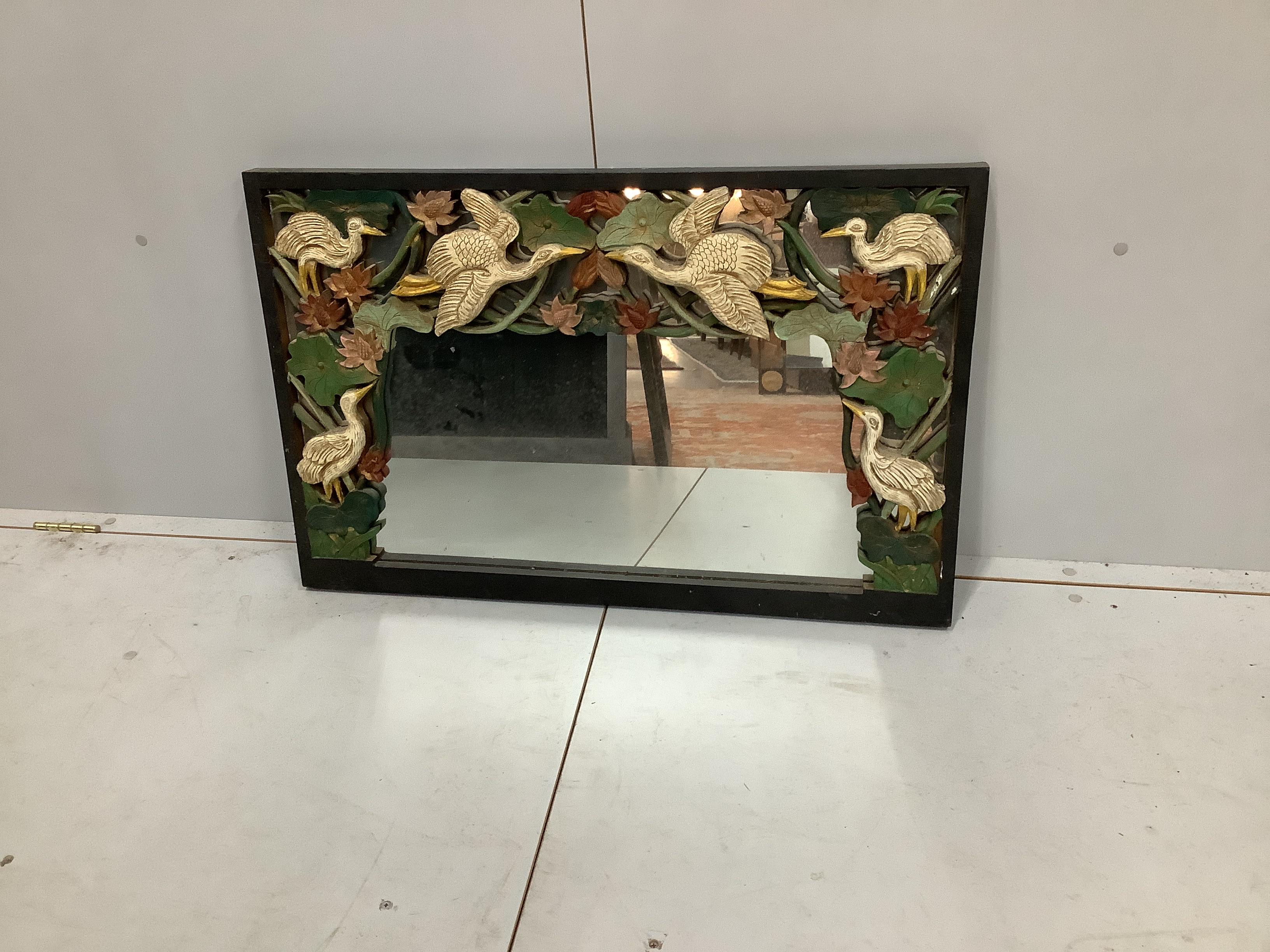 An Indian painted carved hardwood wall mirror, width 88cm, height 58cm                                                                                                                                                      