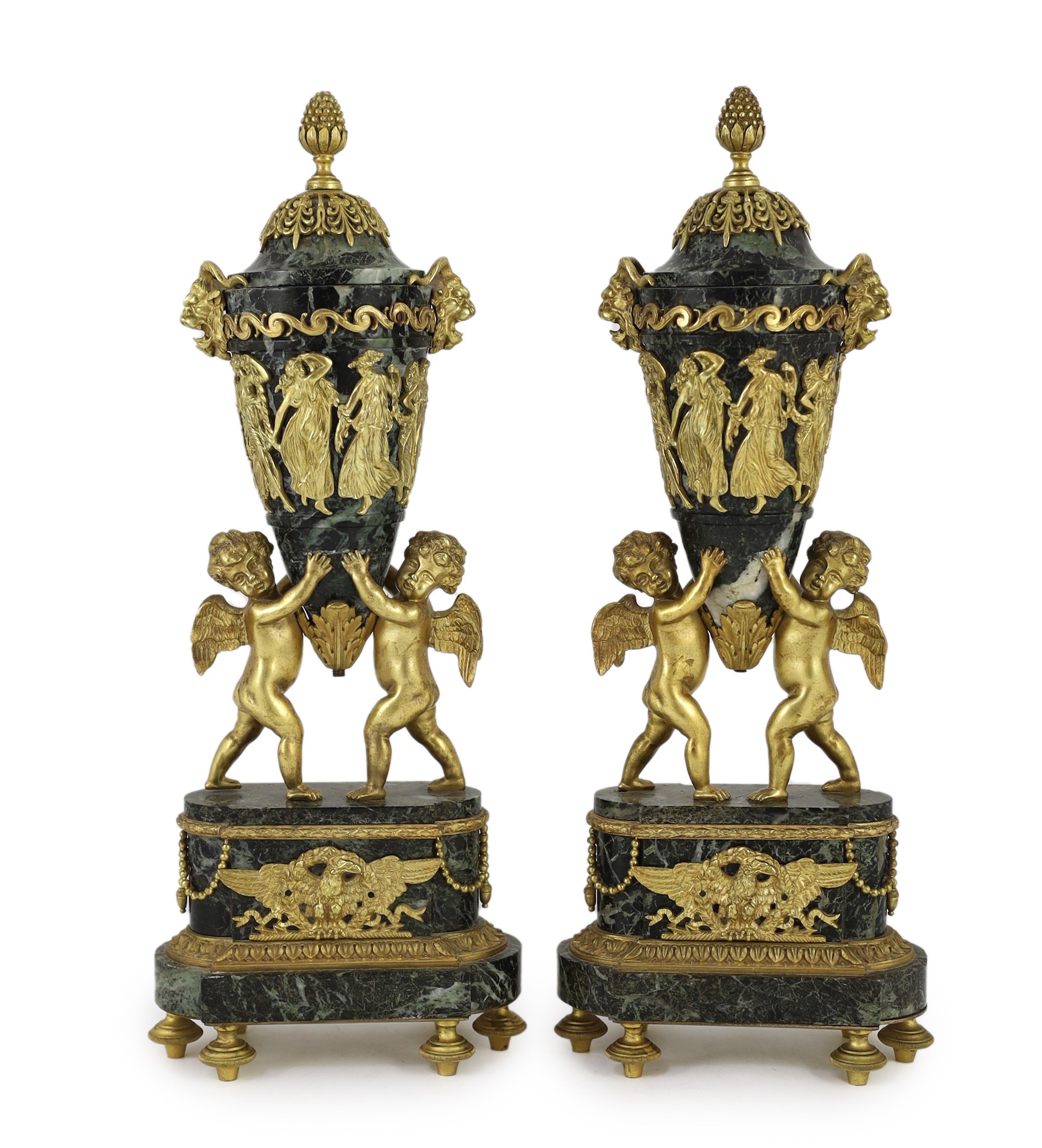 A pair of Louis XVI style ormolu mounted green marble urns Height 41cm.                                                                                                                                                     
