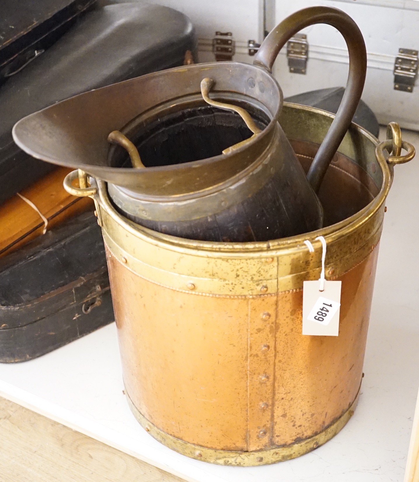 A staved and coopered jug, one coal bucket and a brass kettle stand, 32cms high                                                                                                                                             