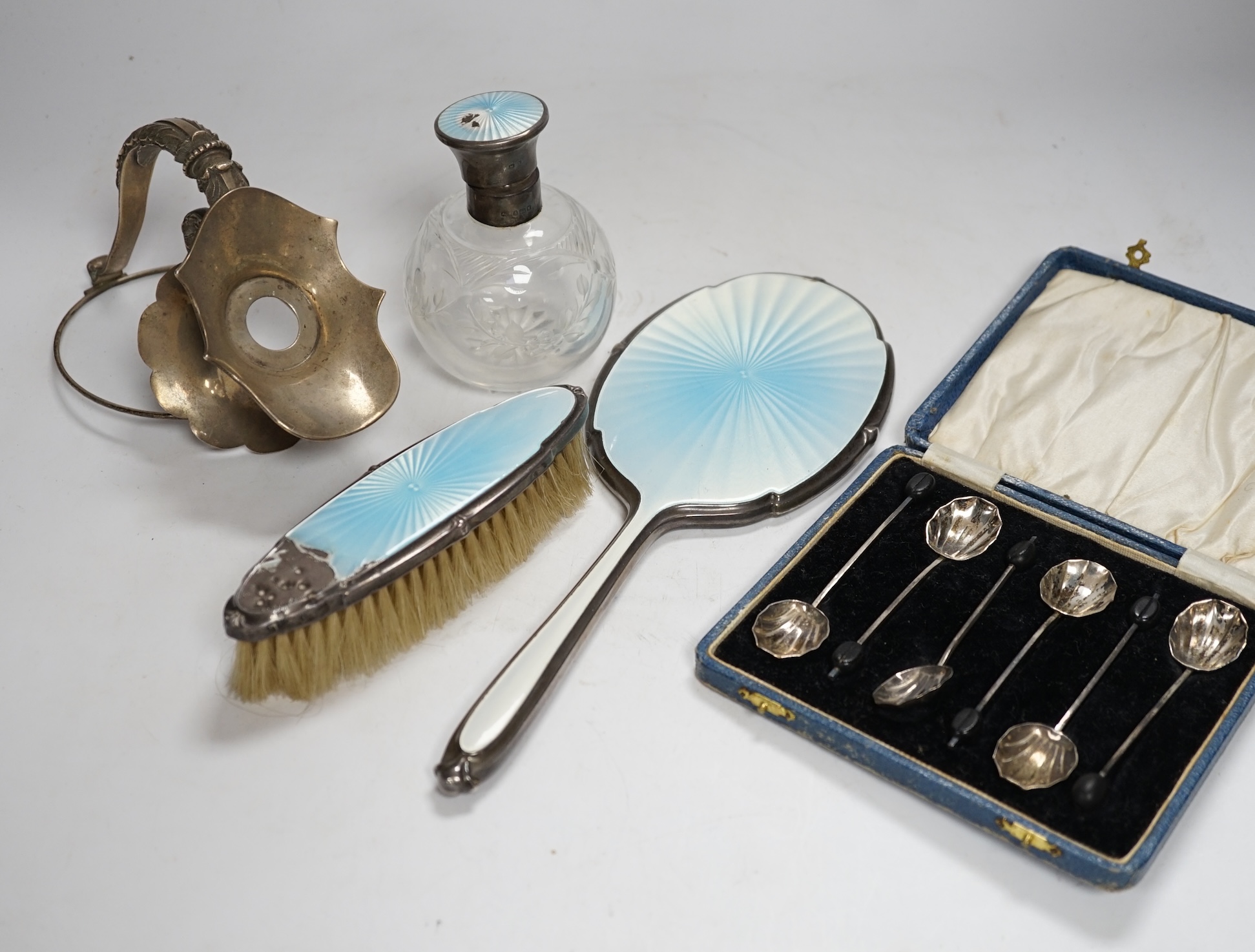 A George V silver claret jug mount, Walker & Hall, Sheffield, 1912, three silver and enamel dressing table items including a hand mirror and a cased set of six silver bean end coffee spoons.                              
