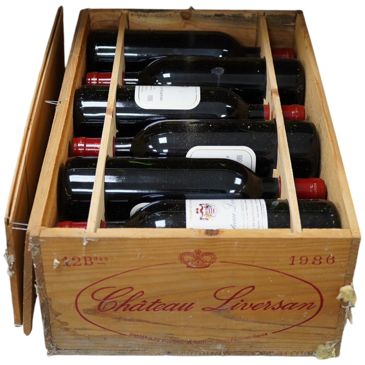 A wooden case of twelve bottles of Chateau Liversan Haut-Medoc 1986 red wine. Condition - good, storage history unknown                                                                                                     