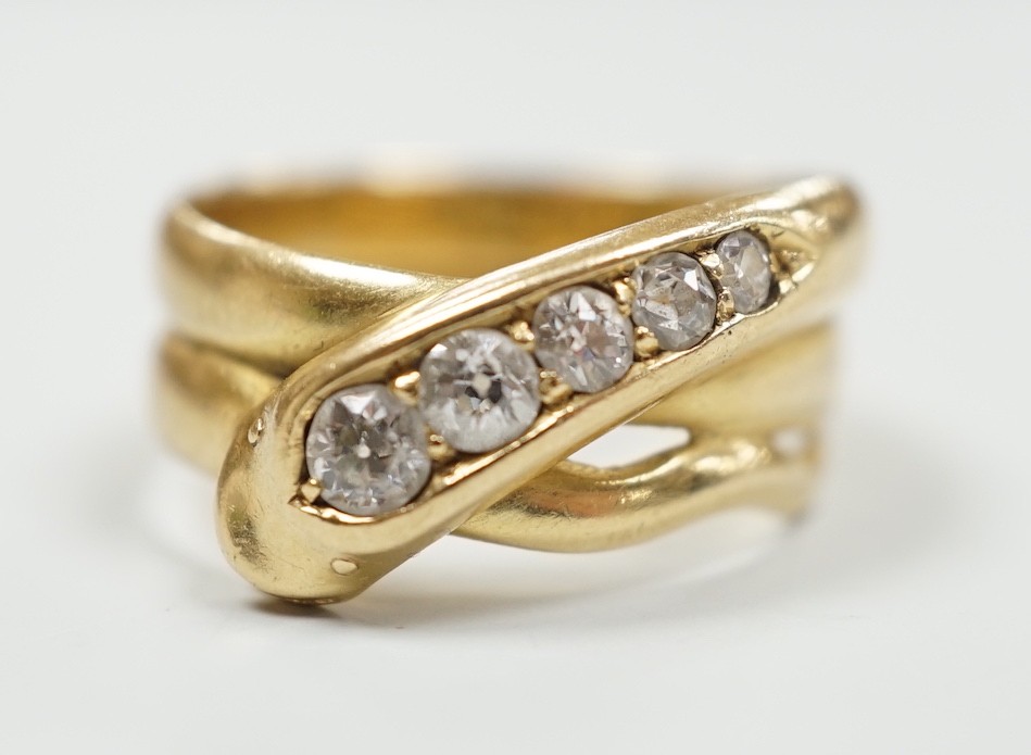 A late Victorian18ct gold and graduated five stone diamond set serpent ring, Hallmarked for Chester, 1897, size P/Q, gross weight 7.3 grams.                                                                                