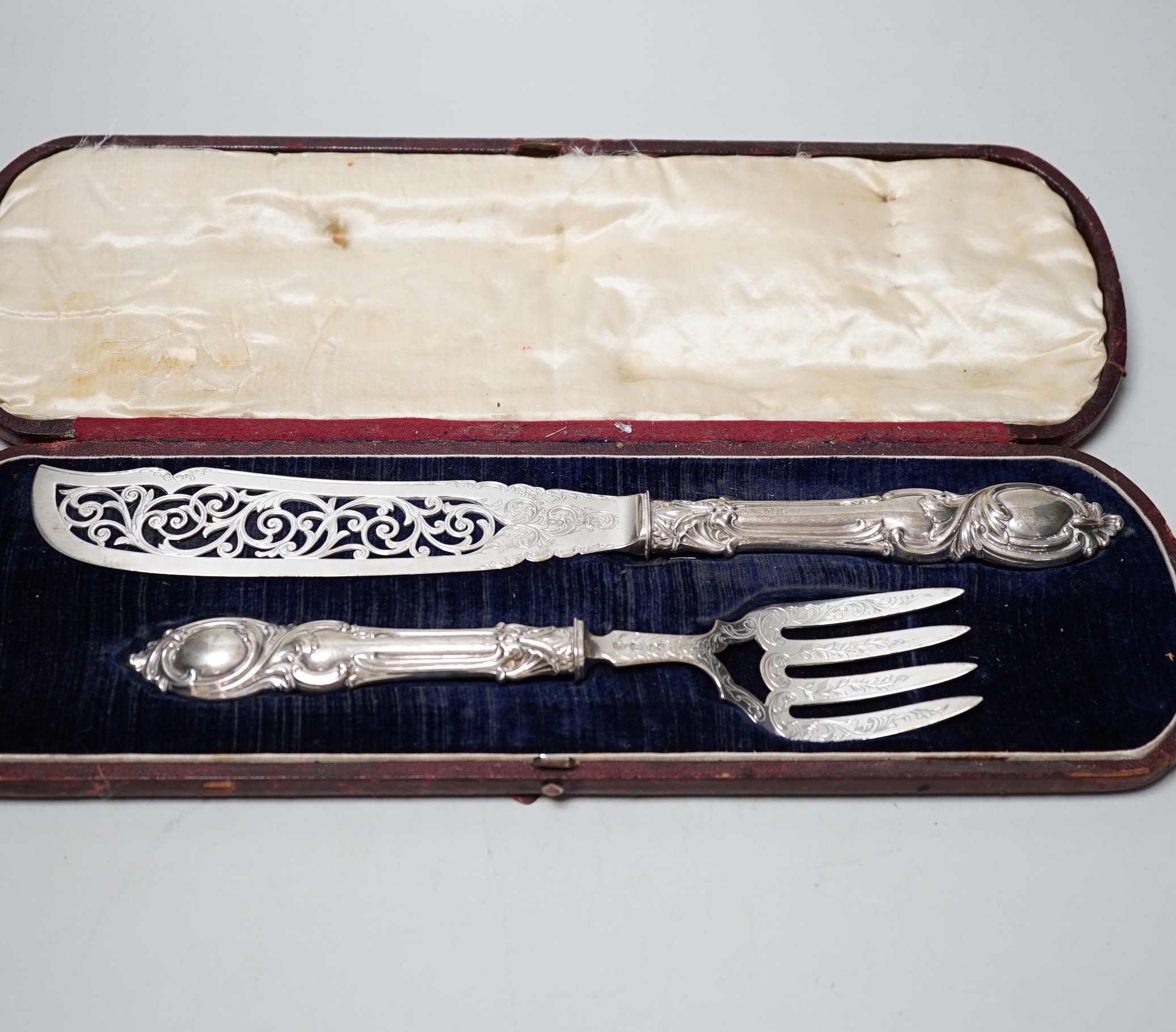 A cased pair of Victorian silver fish servers, John Gilbert, Birmingham, 1853, knife 32.5cm.                                                                                                                                