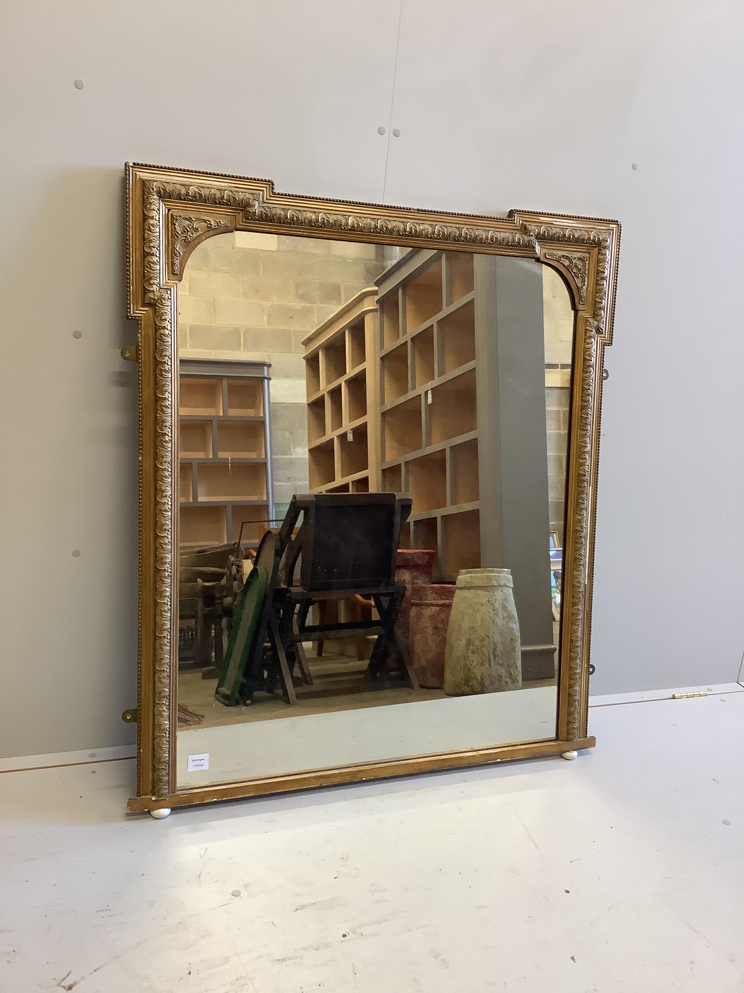 A late Victorian giltwood and composition overmantel mirror, width 107cm, height 123cm                                                                                                                                      