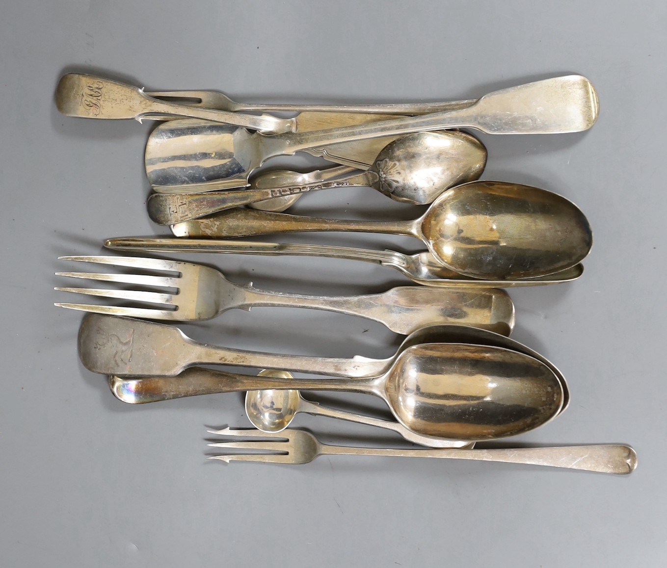 A small quantity of assorted mainly 19th century silver flatware, including a Victorian silver marrow scoop, London, 1861 and a George IV silver stilton scoop, London, 1826, 15oz.                                         