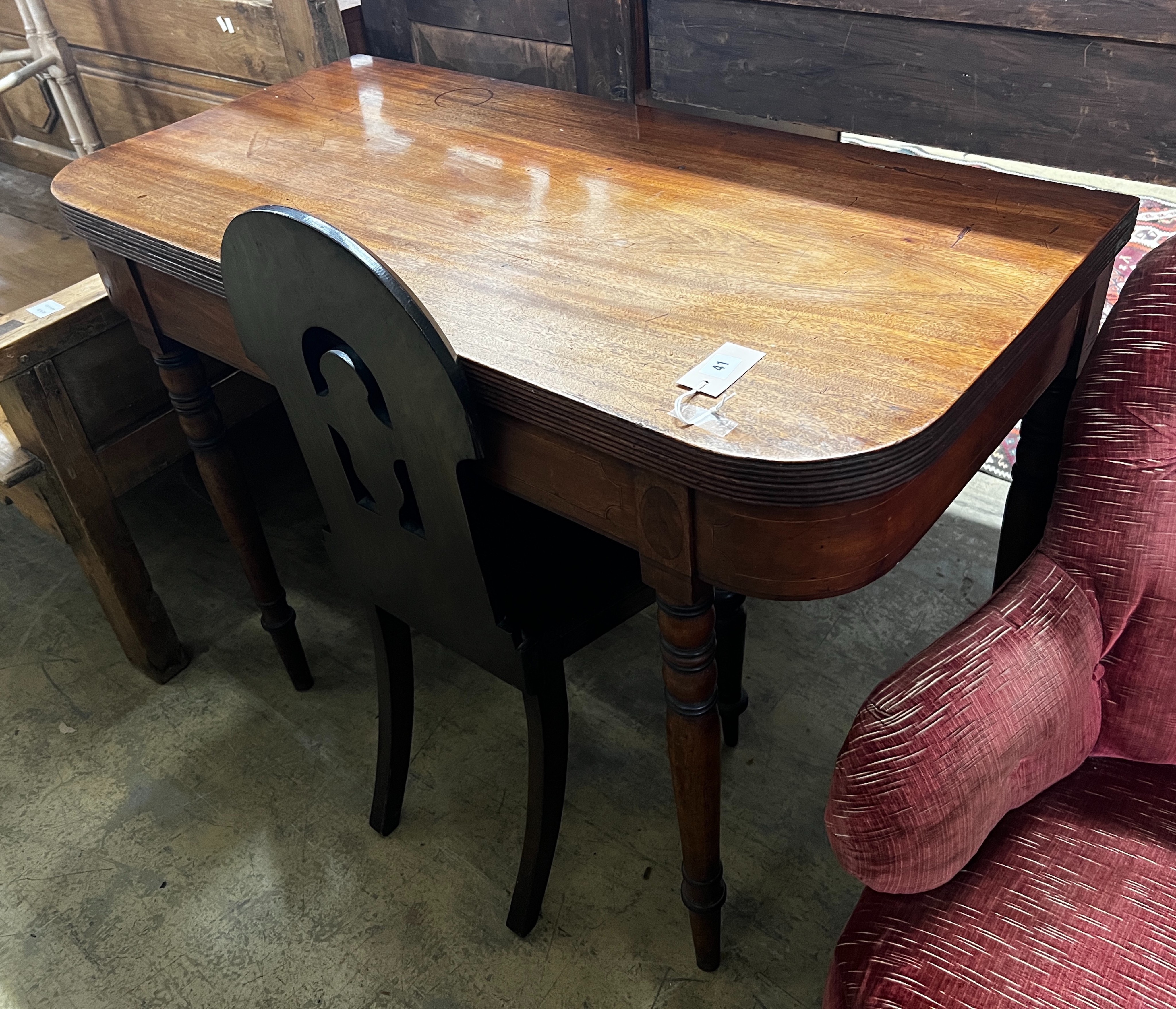 A Regency mahogany folding tea table, width 106cm, depth 52cm, height 77cm and a Victorian oak hall chair                                                                                                                   