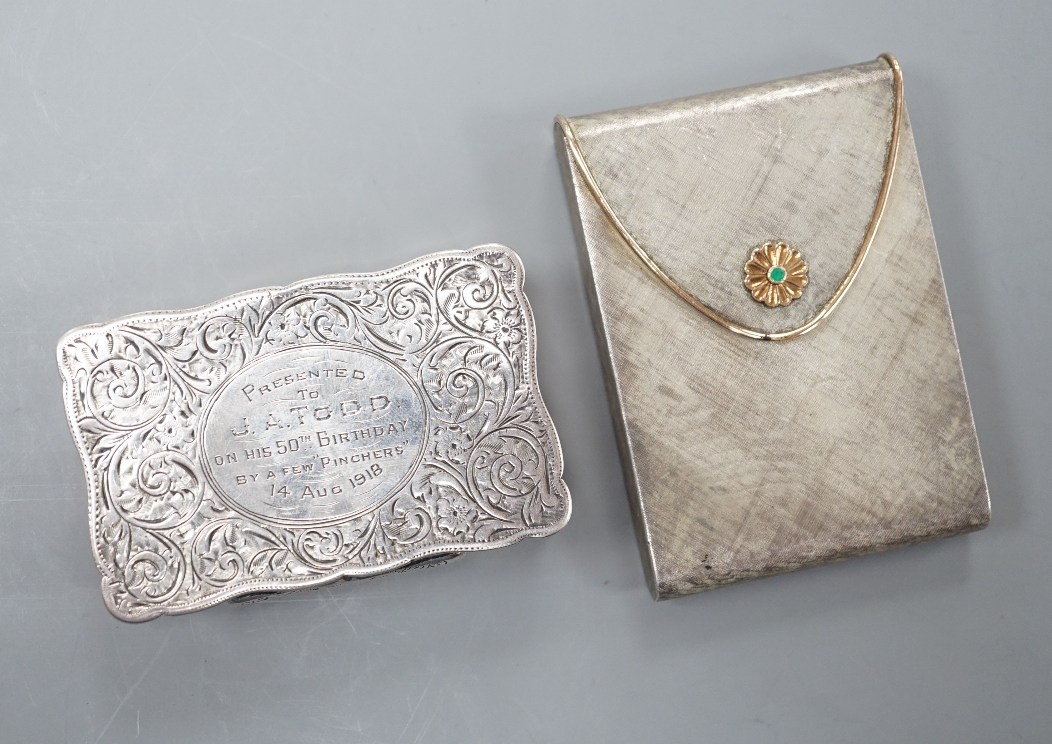 A George V engraved silver snuff box, Joseph Gloster Ltd, Birmingham, 1913, 71mm, with engraved inscription, together with and Italian brushed 925 and 750 cigarette case.                                                  
