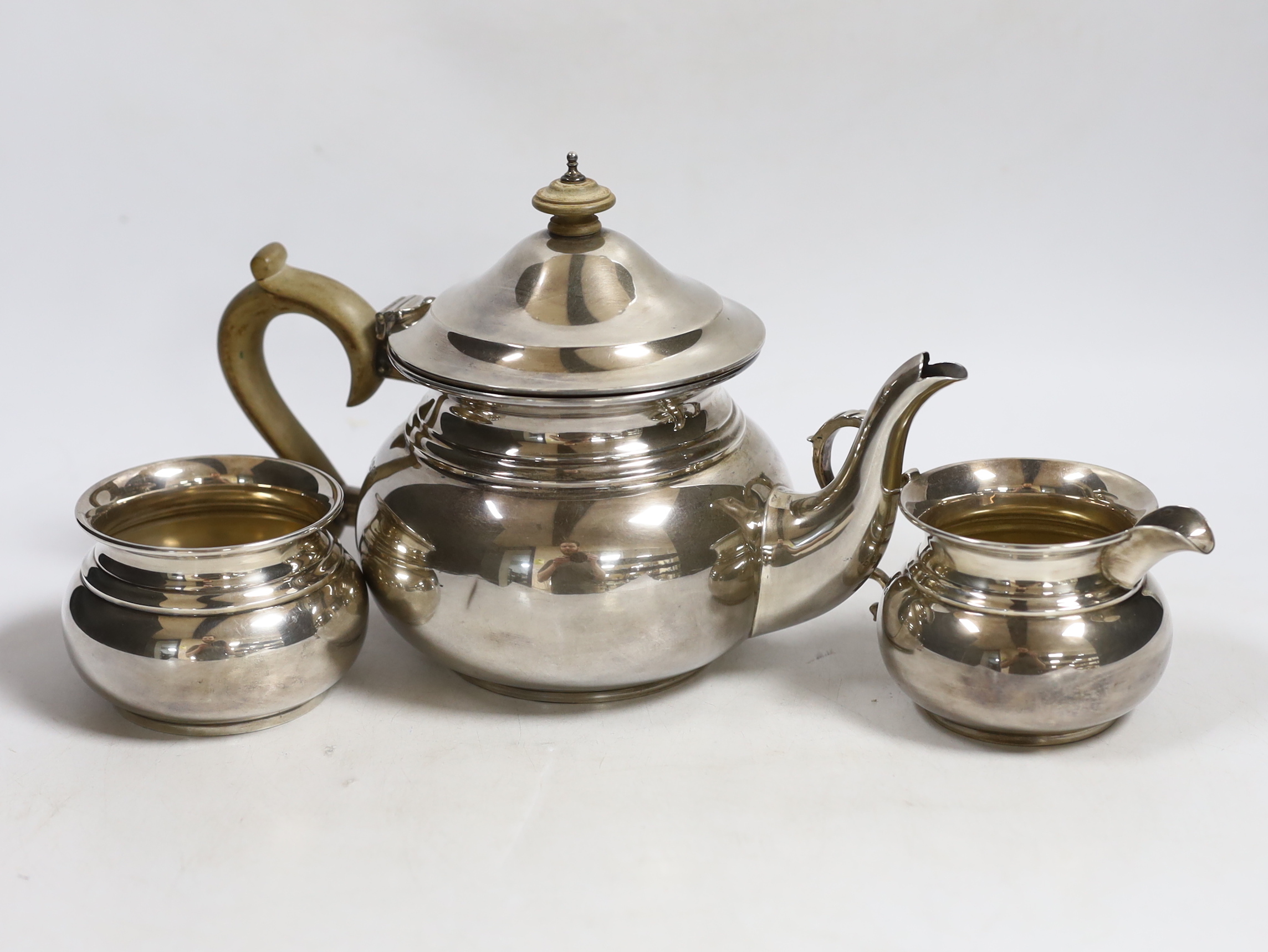 A George V silver three piece tea set, Blackmore & Fletcher Ltd, London, 1925                                                                                                                                               