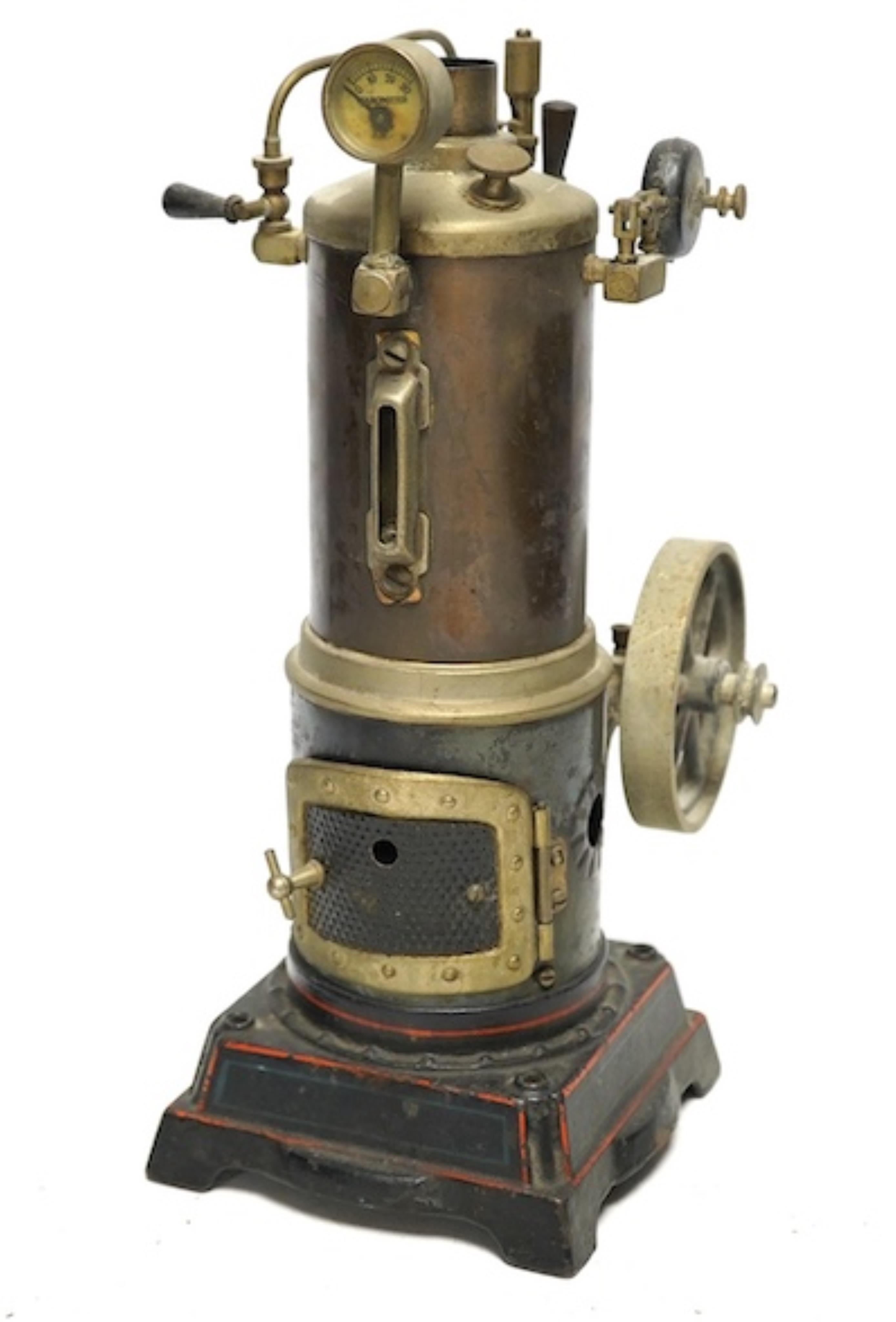 A Doll and Co. tinplate vertical boiler live steam single cylinder stationary engine, 26cm high. Condition - fair                                                                                                           