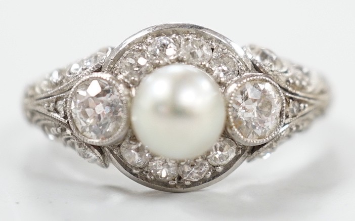 A white metal(stamped Platin), cultured pearl and diamond set circular cluster ring, size M, gross weight 5 grams.                                                                                                          