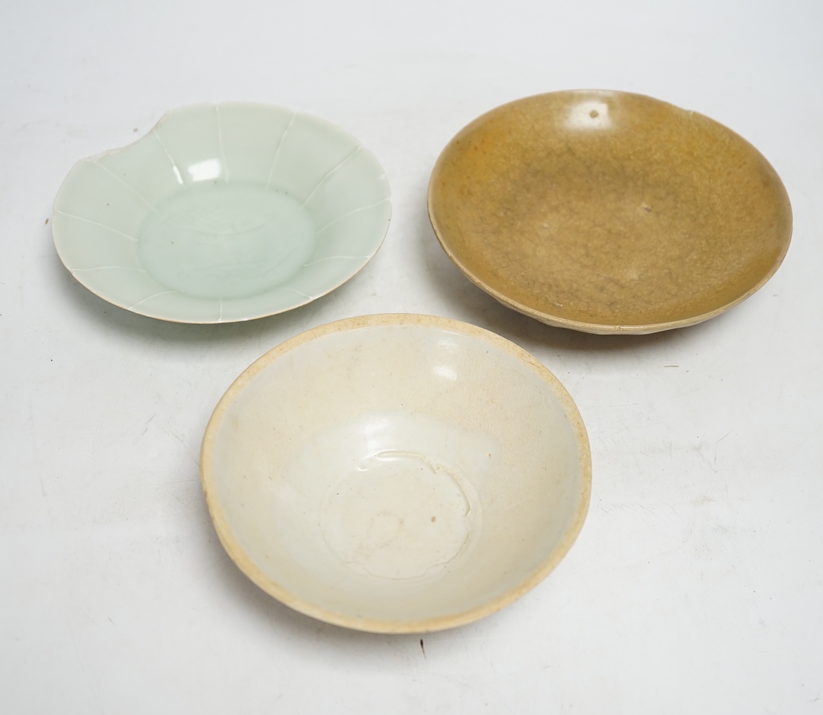 Two Chinese qingbai dishes and a Yue ware bowl, Song-Yuan dynasty, widest 17cm diameter                                                                                                                                     