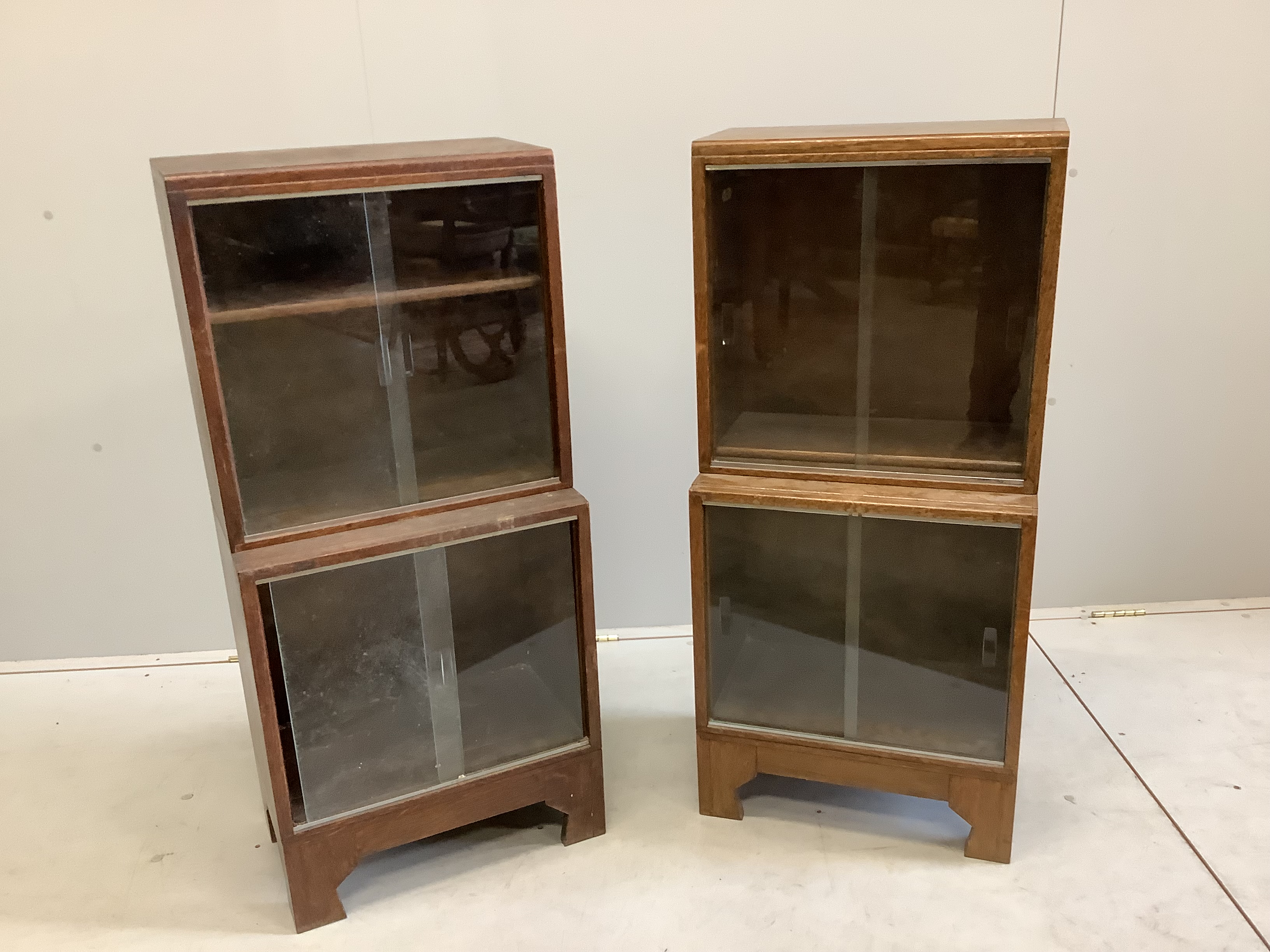 A pair of small Minty oak glazed two section bookcases, width 46cm, depth 29cm, height 102cm                                                                                                                                