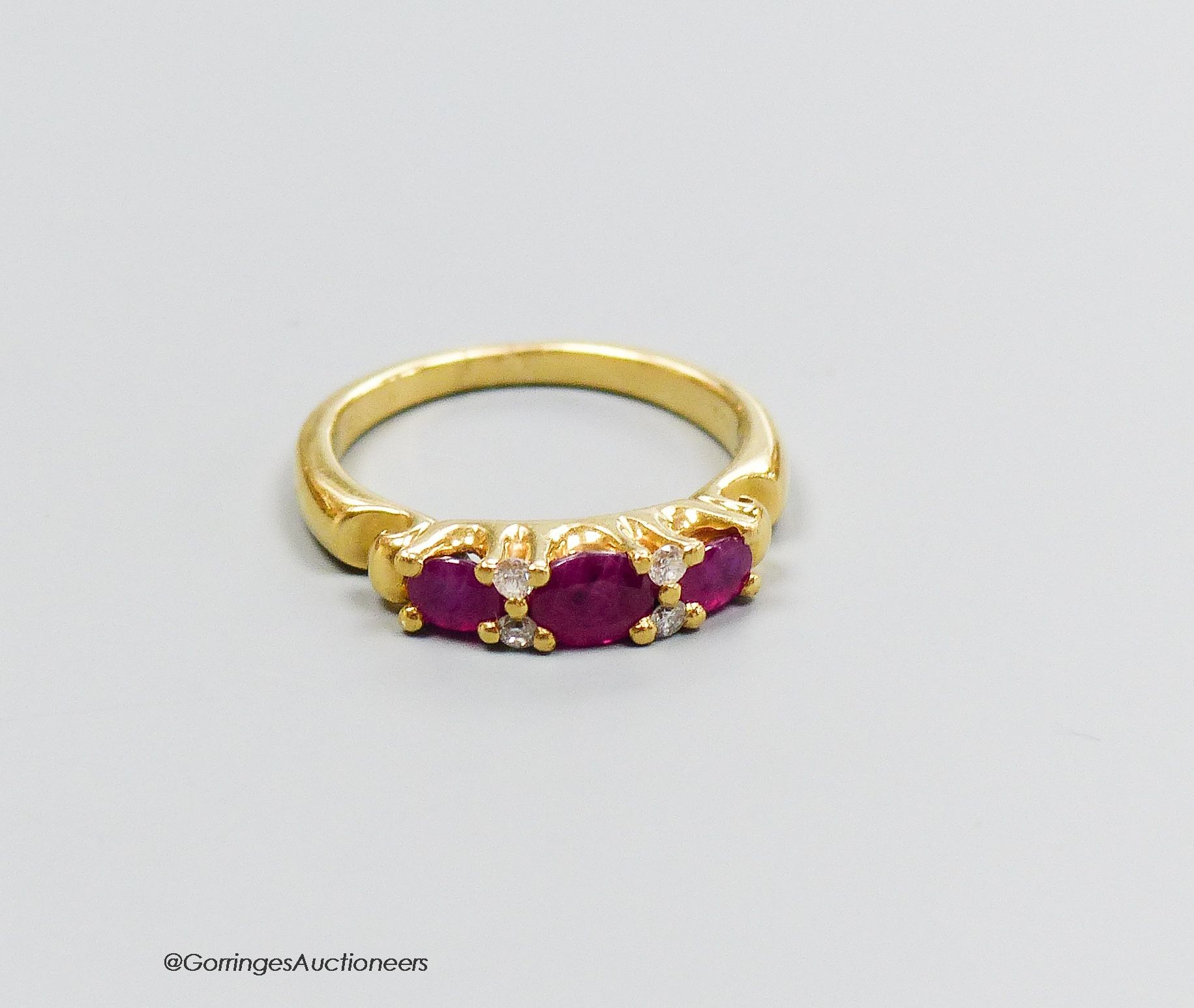 A 18ct gold ruby and diamond ring, size M, gross 5g.                                                                                                                                                                        