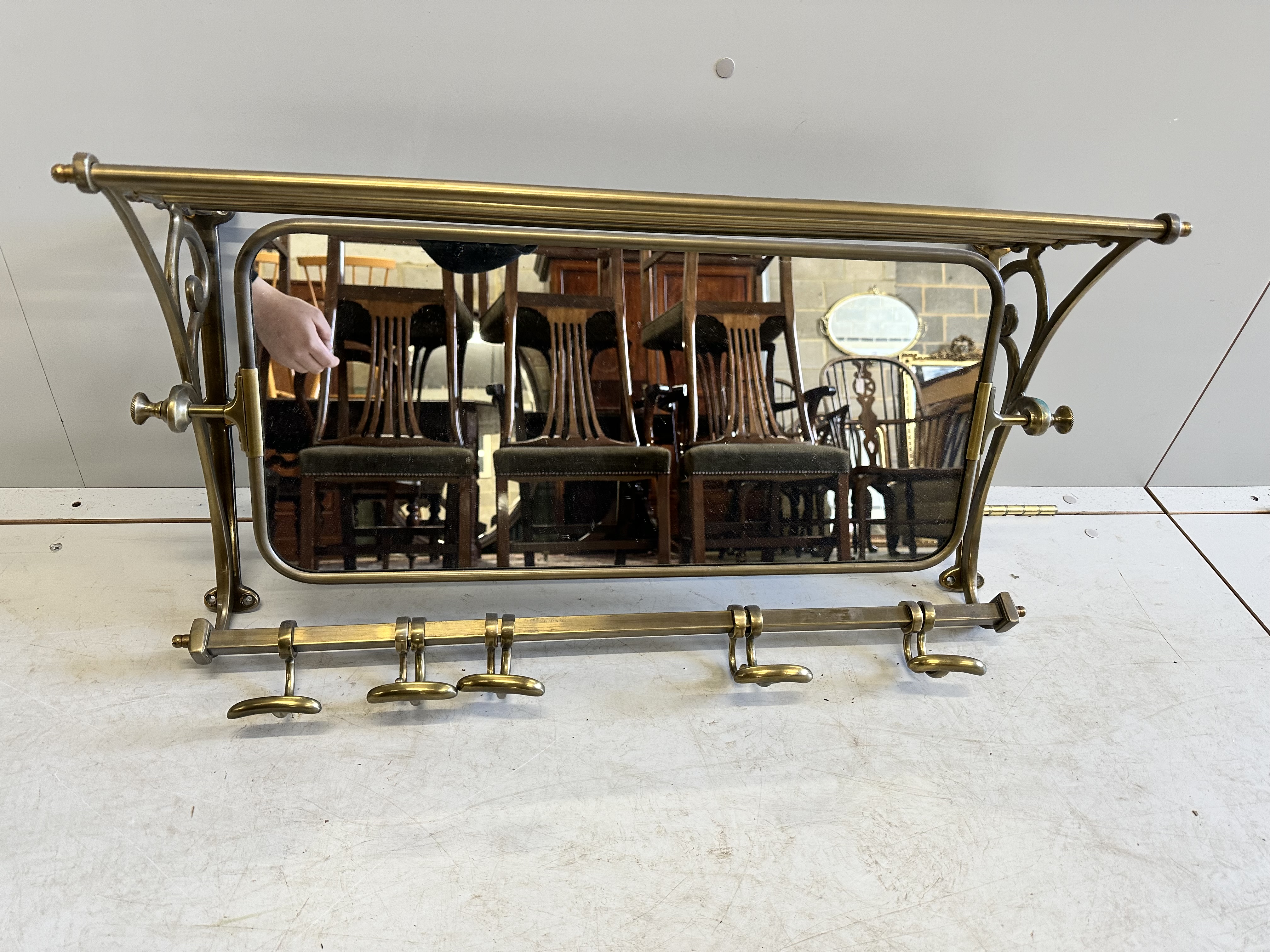 A French mirrored brass hanging coat stand, width 75cm, depth 23cm, height 38cm                                                                                                                                             