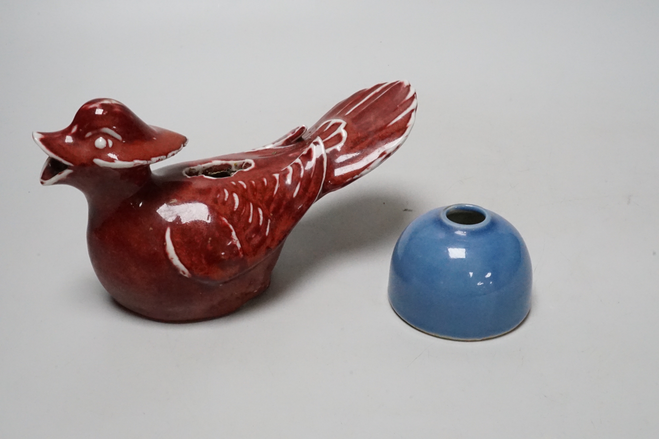 A Chinese sang de boeuf cockerel and blue glazed inkwell, cockerel 18cm wide                                                                                                                                                