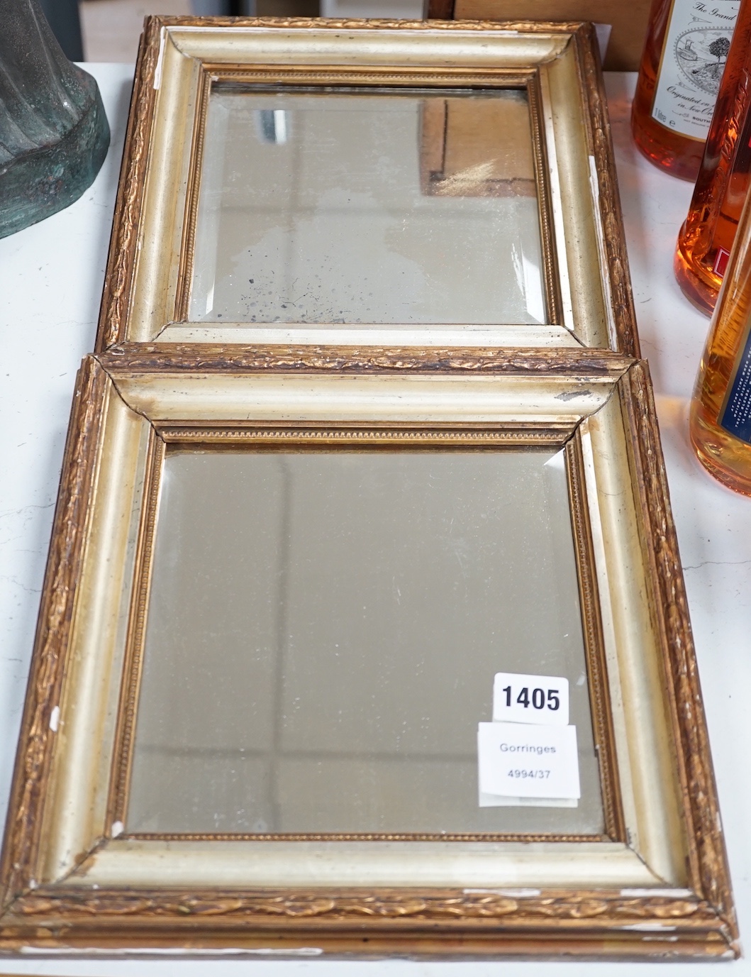 A pair of squared bevelled wall mirrors (2) 29cm sq including frames                                                                                                                                                        