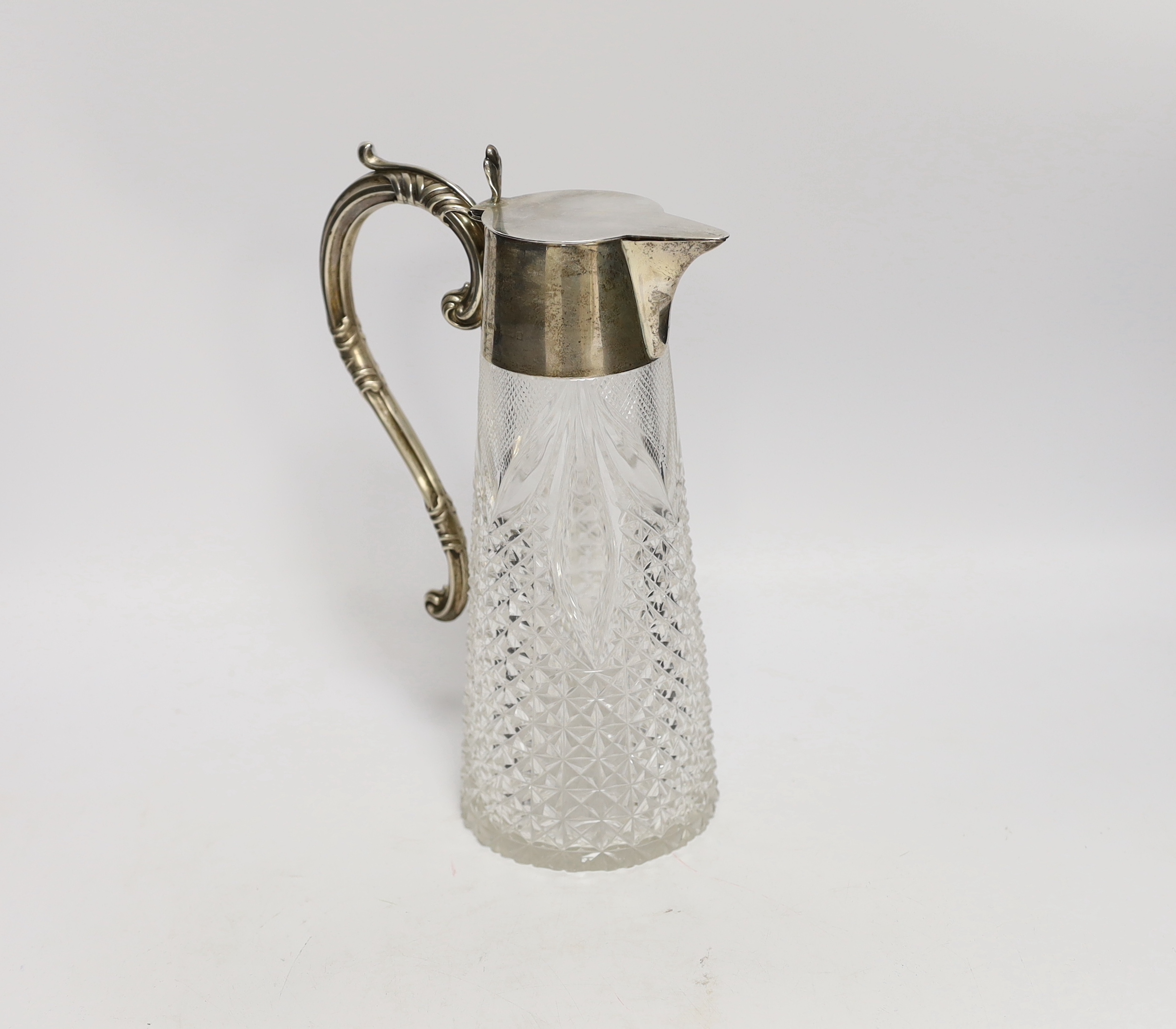 An Edwardian silver mounted cut glass claret jug, William Henry Sparrow, Birmingham, 1903, 26cm.                                                                                                                            